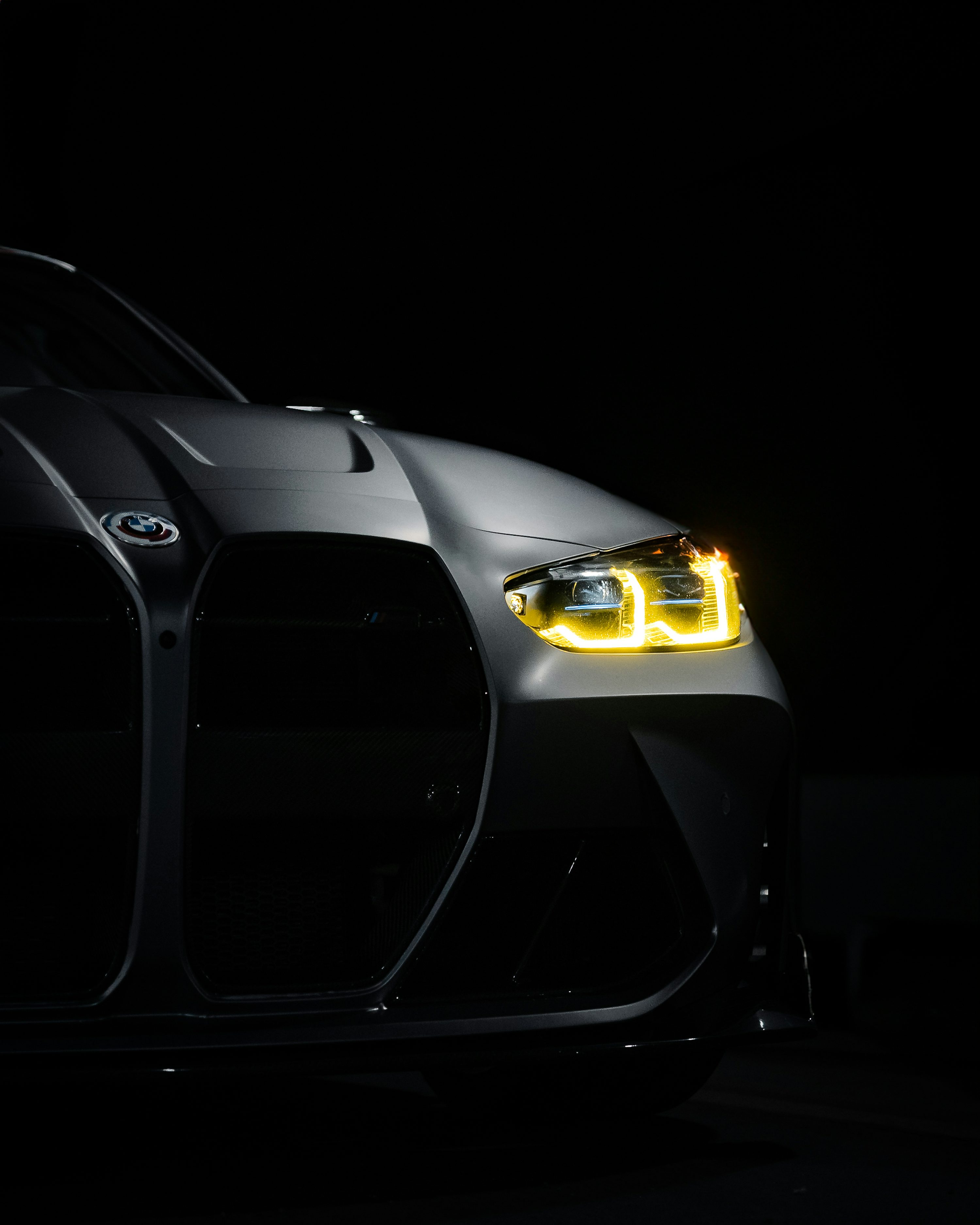 A car that is sitting in the dark photo