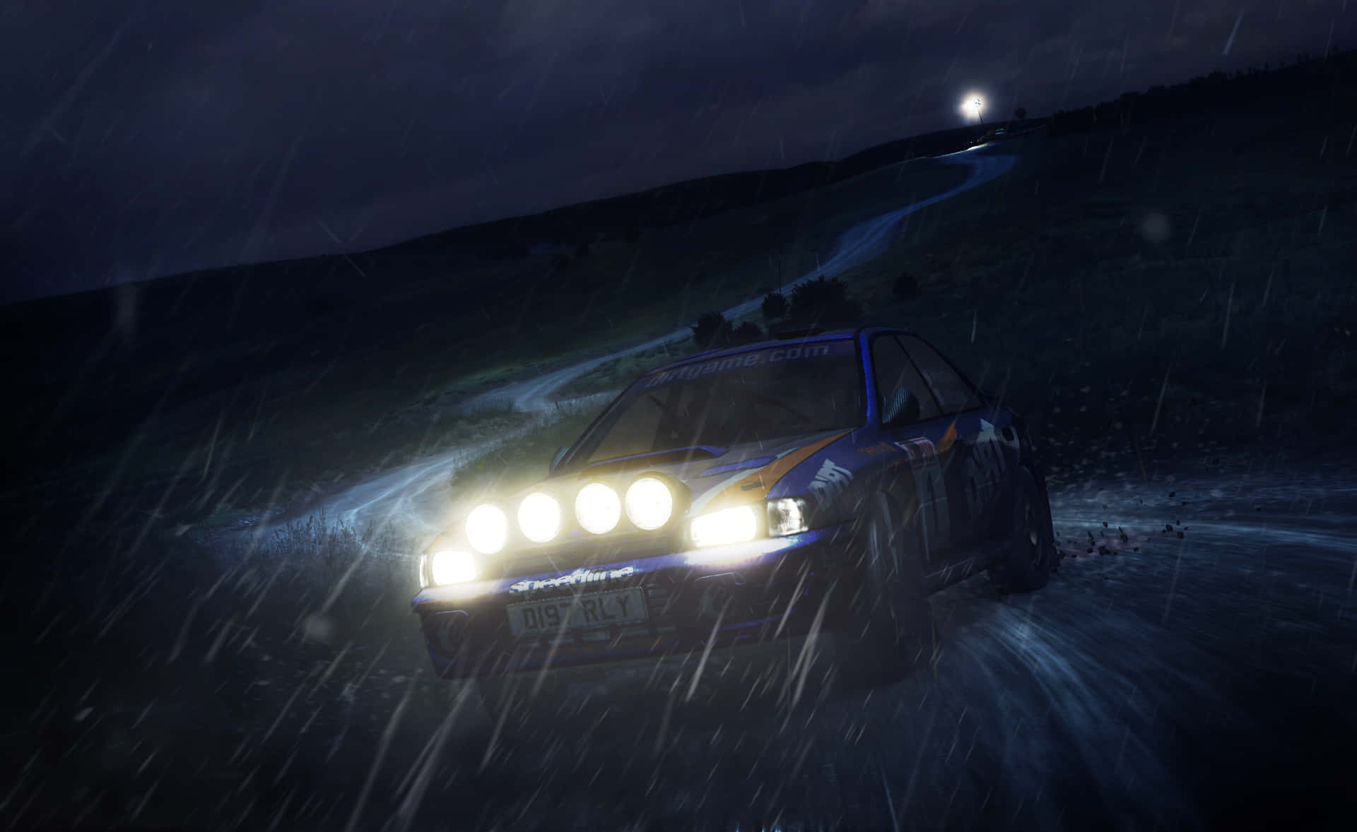 Download A Car Driving Through A Rainy Night Wallpaper