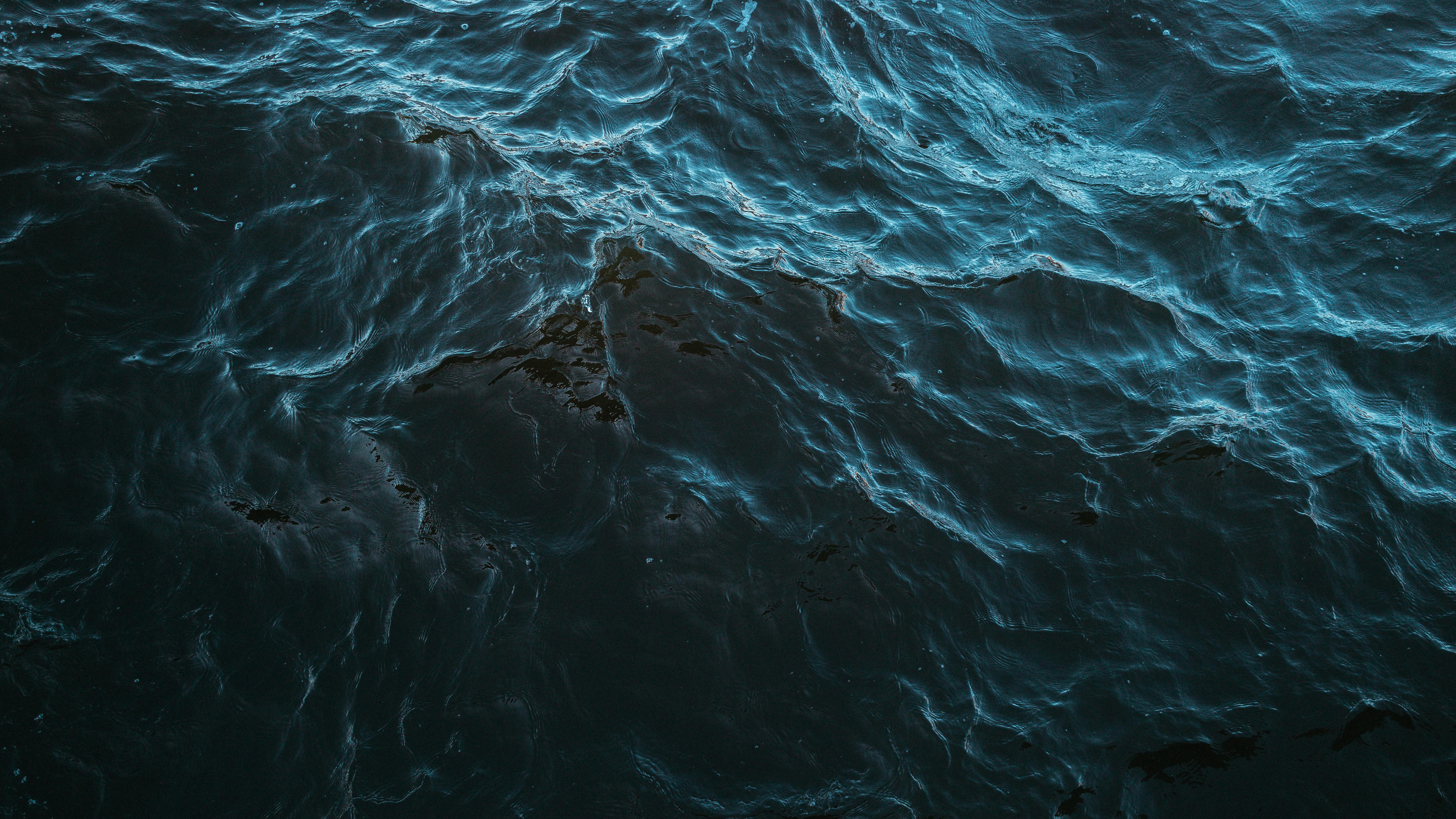 Serene Dark Blue Ocean Waves Captured Close Up · Free