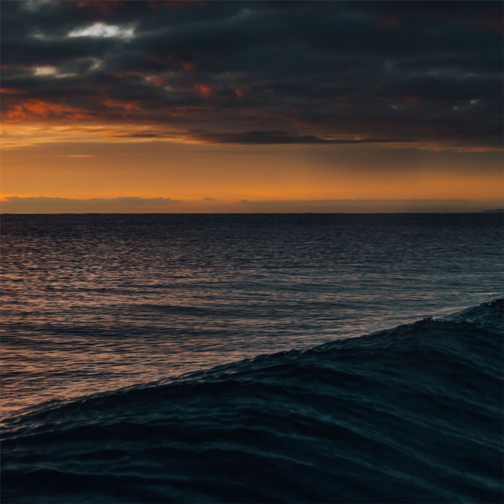 waves cloudscape dark orange 4k iPad Air Wallpaper Free Download