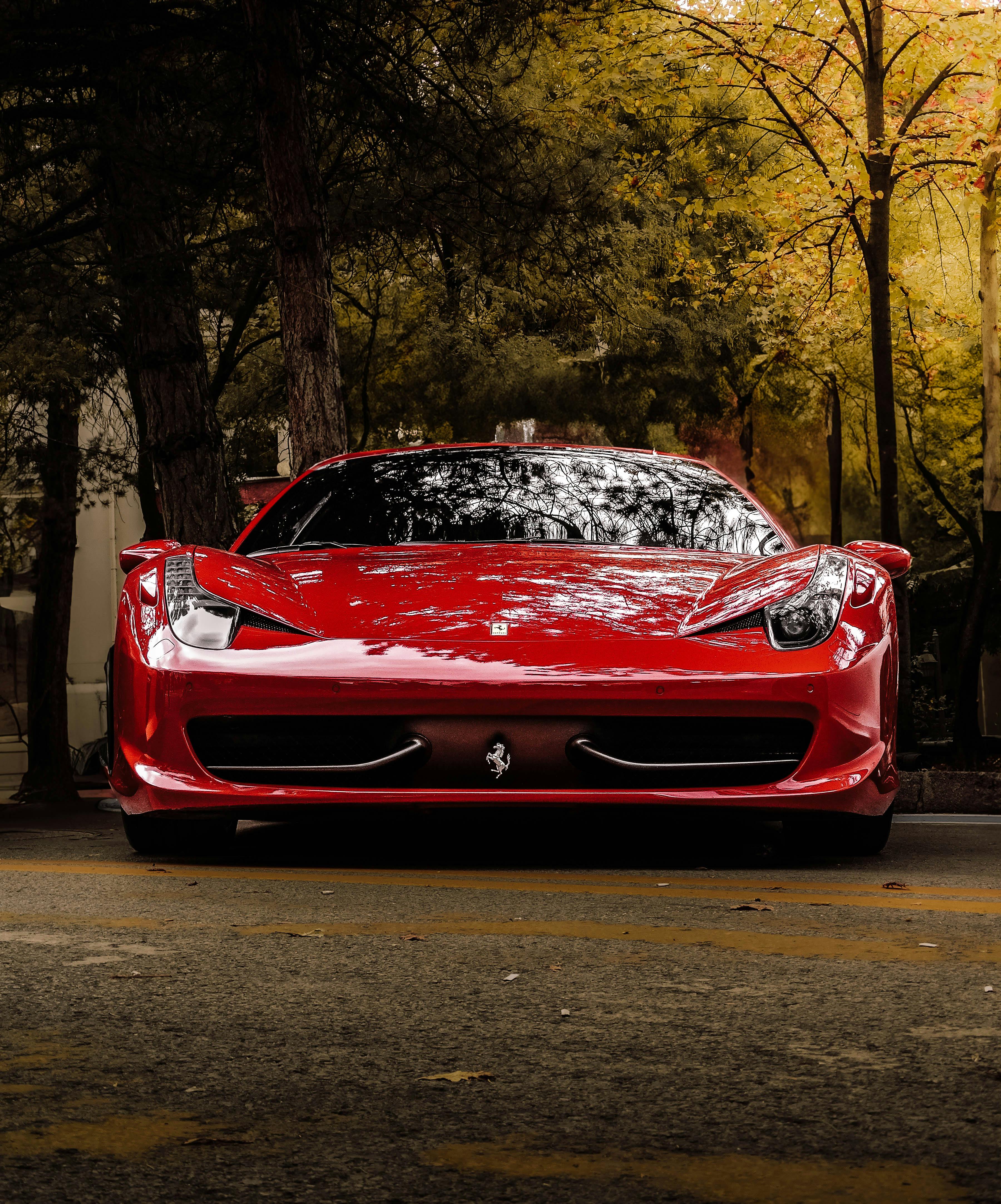 A Modern Red Car Covered in Foam · Free