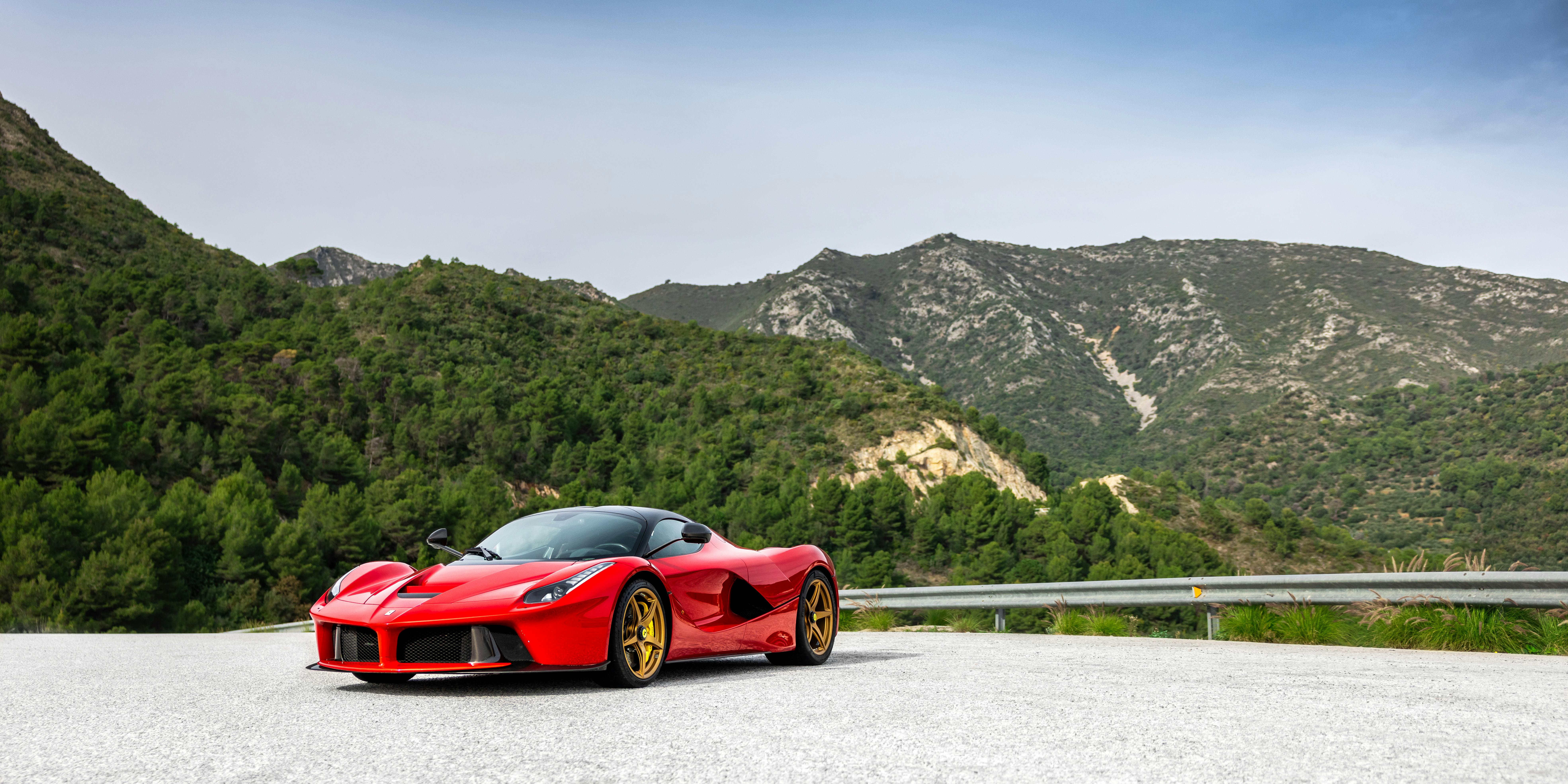 Stunning Red Sports Car on Mountain Road · Free
