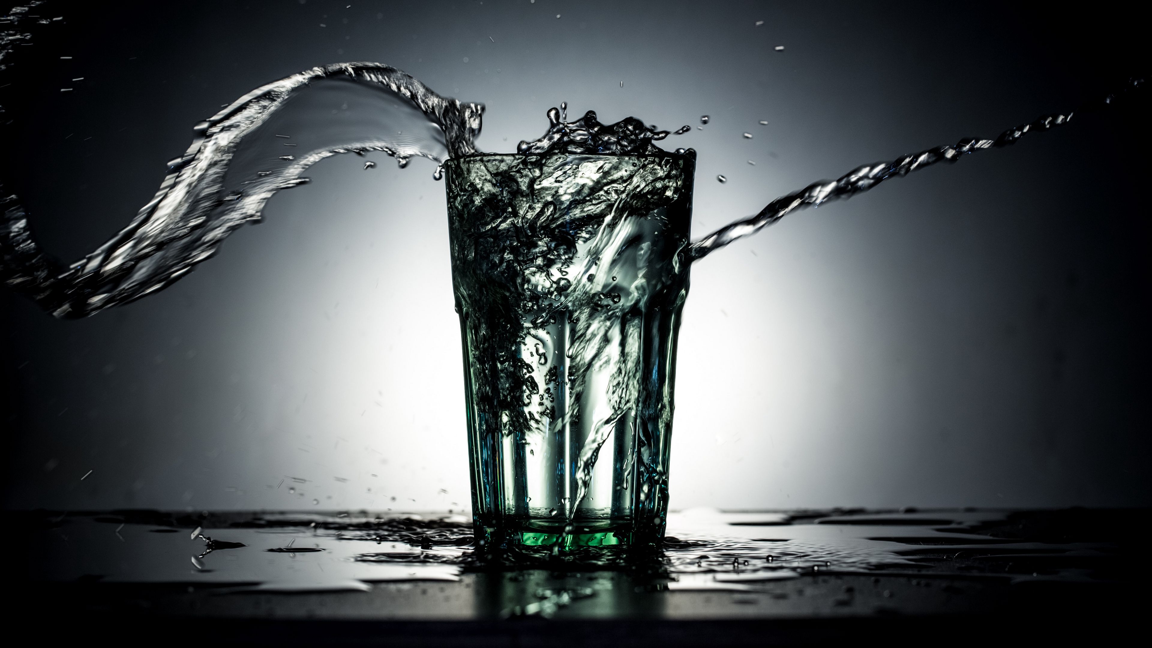 Download wallpaper 3840x2160 glass, splashing, splash, dark, water, liquid 4k uhd 16:9 HD background