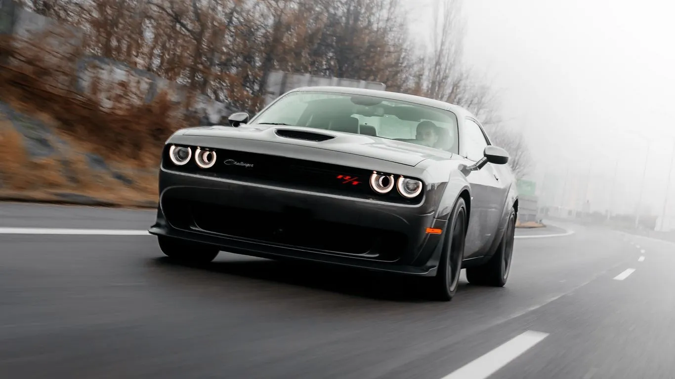 Download wallpaper 1366x768 dodge challenger, dodge, car, road, speed tablet, laptop HD background