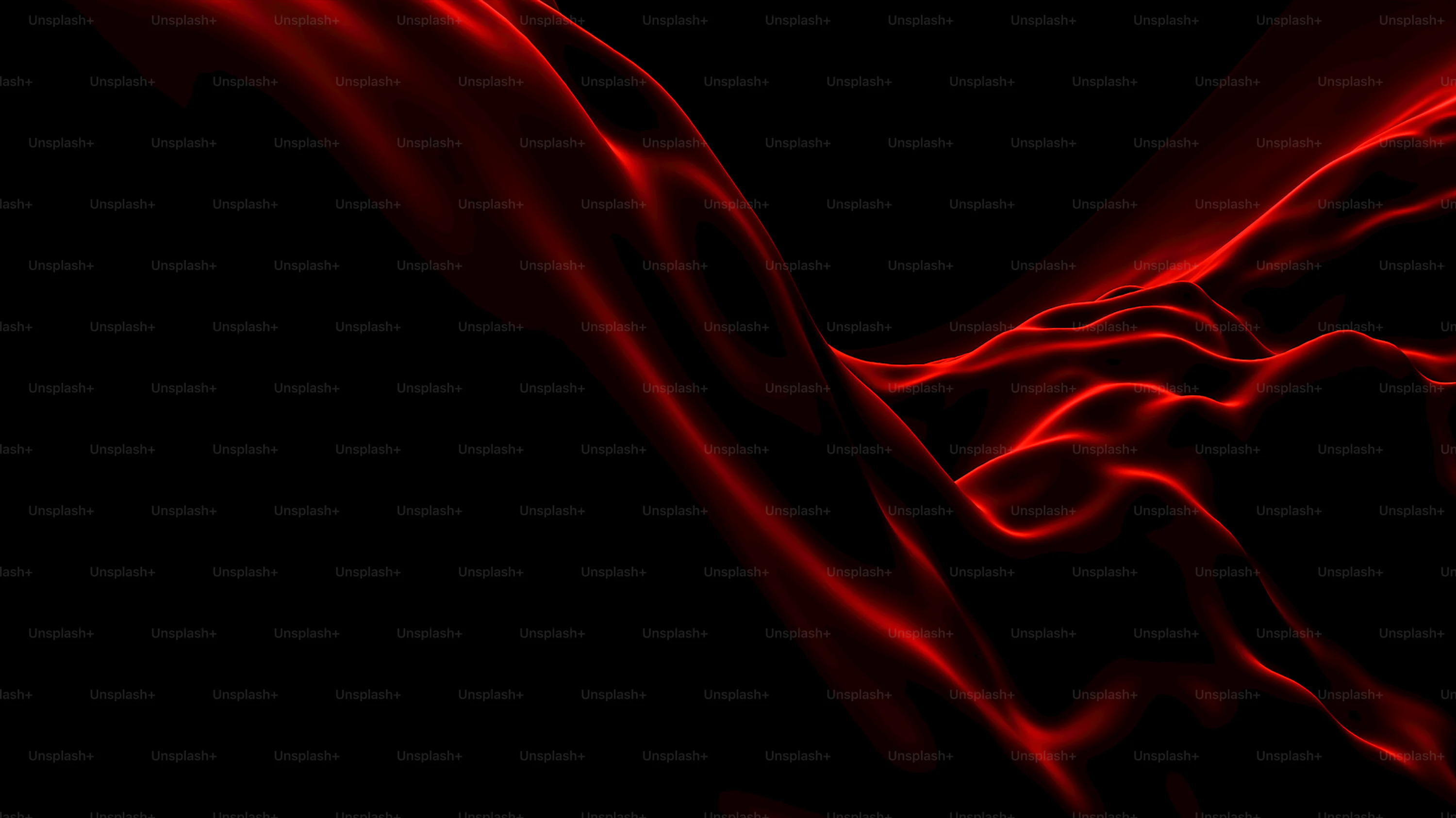 A black and red background with a wavy pattern photo