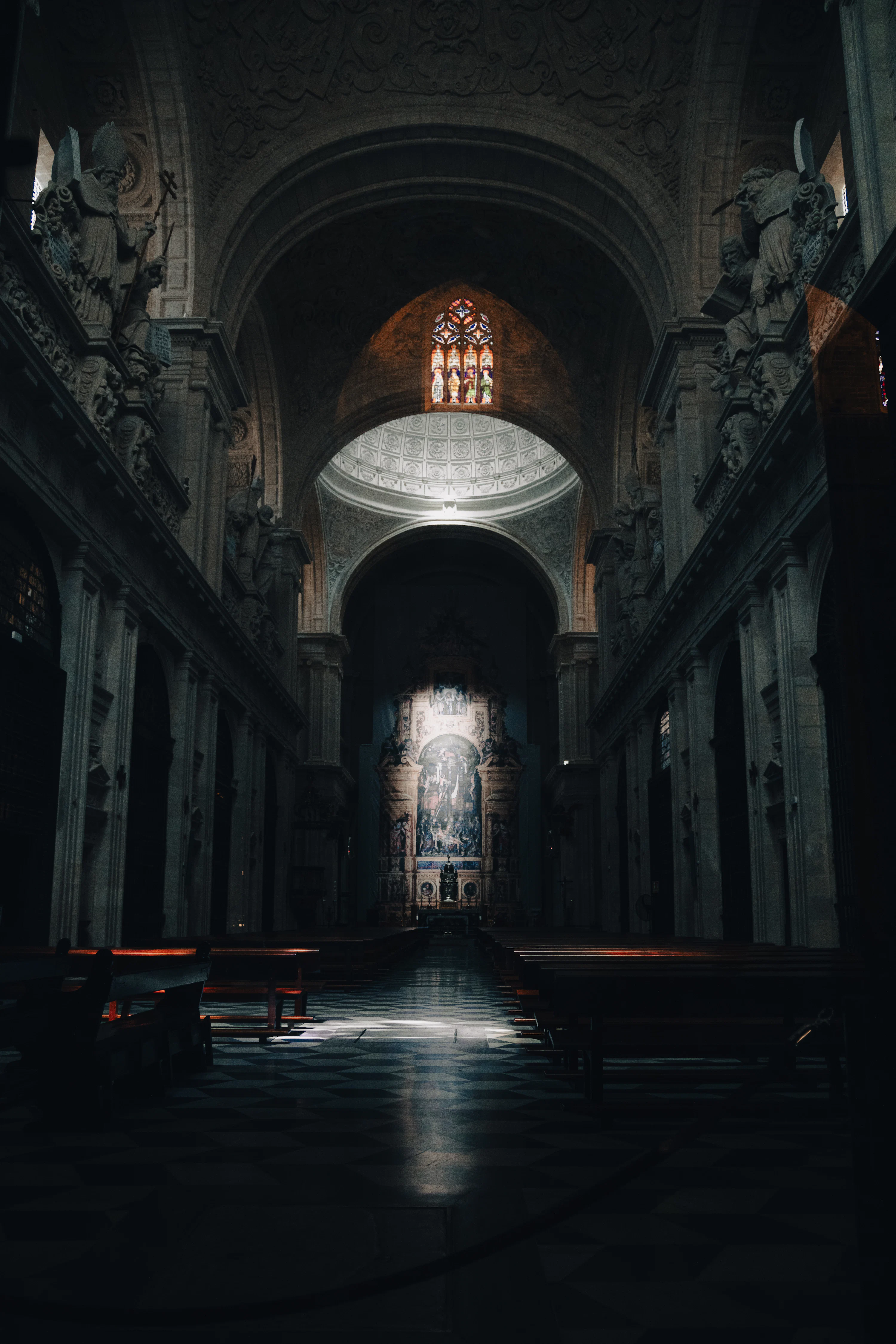 An empty church with pews and stained glass windows photo