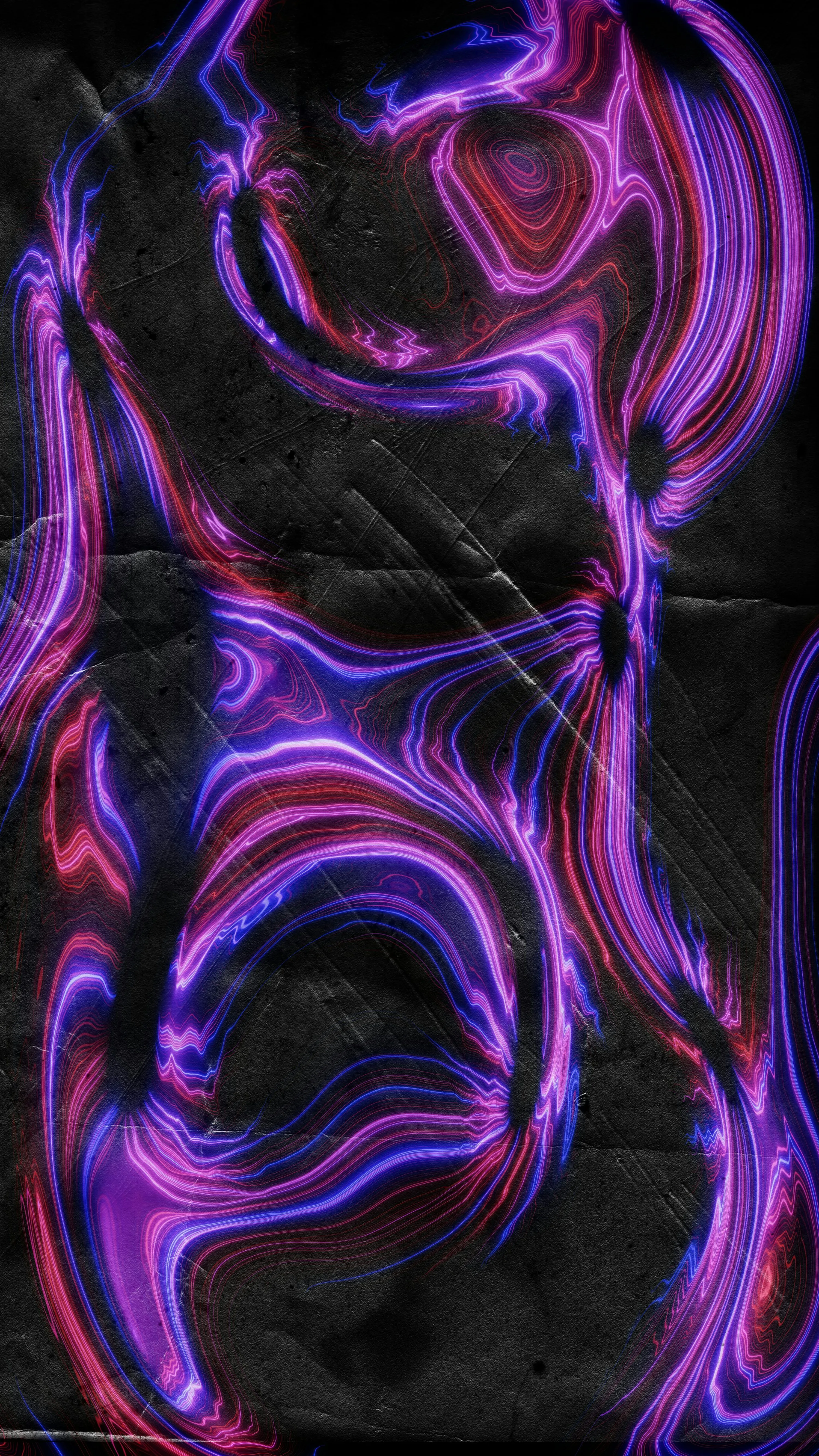 Purple and red neon lines on a textured black surface. photo