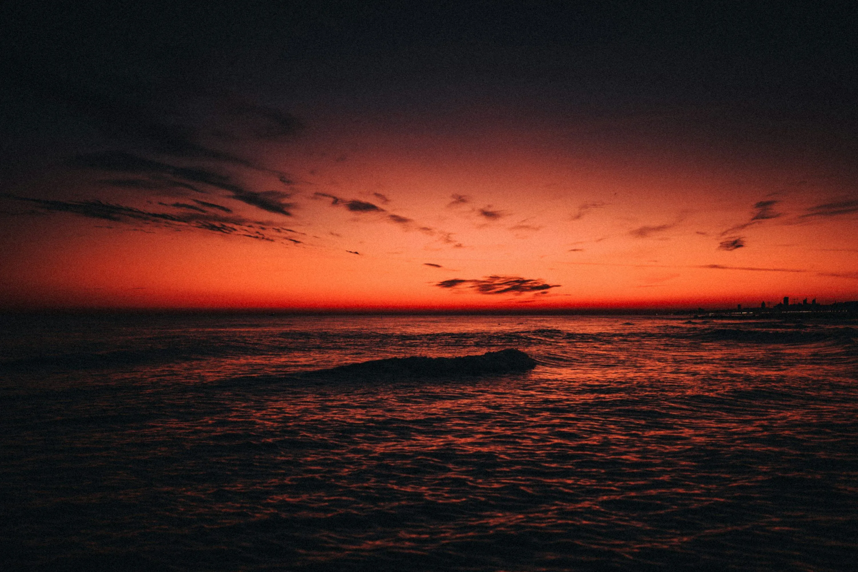 Fiery sunset over the ocean's dark waters. photo