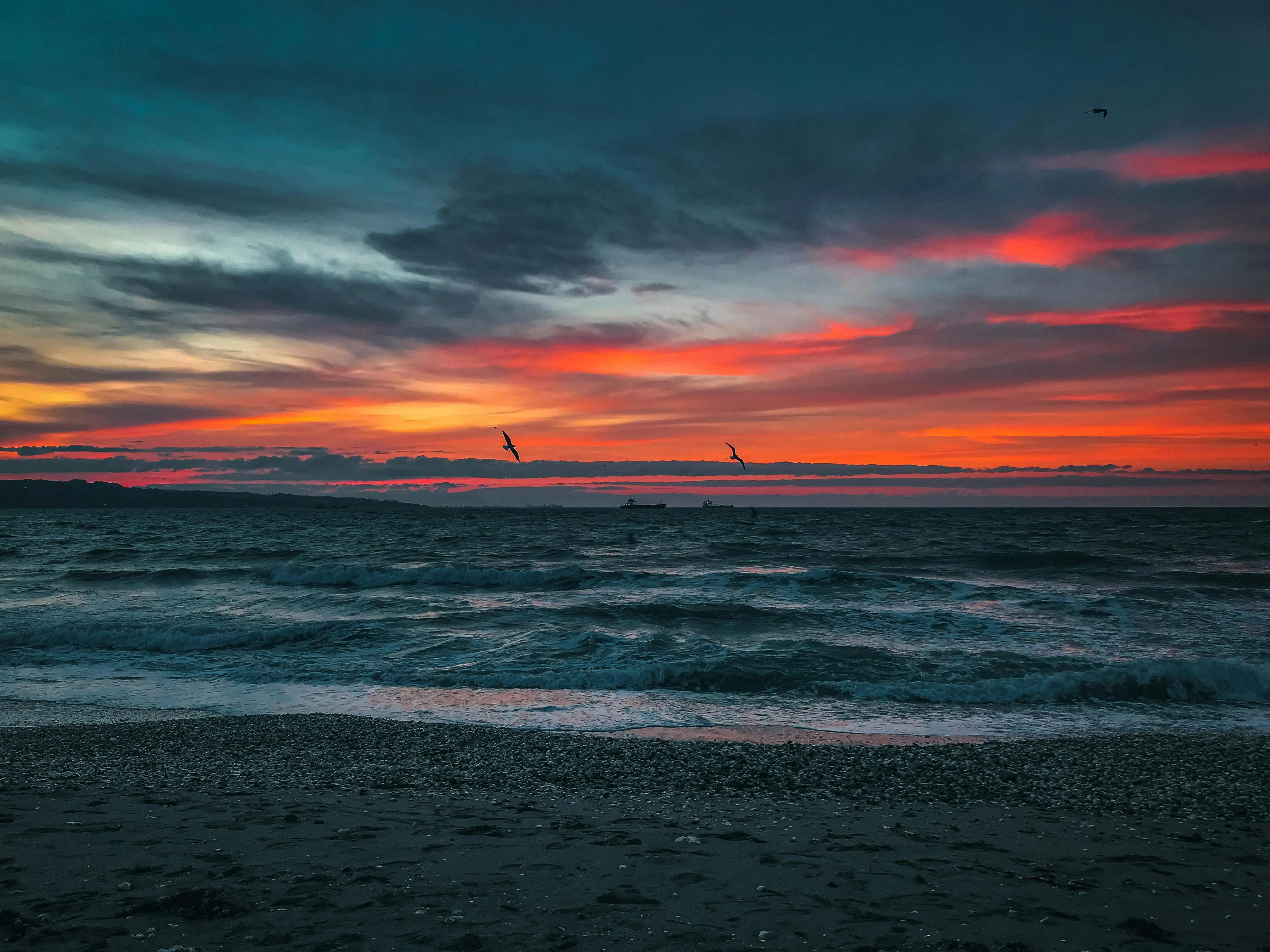 Body of Water Under Red Sky during Sunset · Free