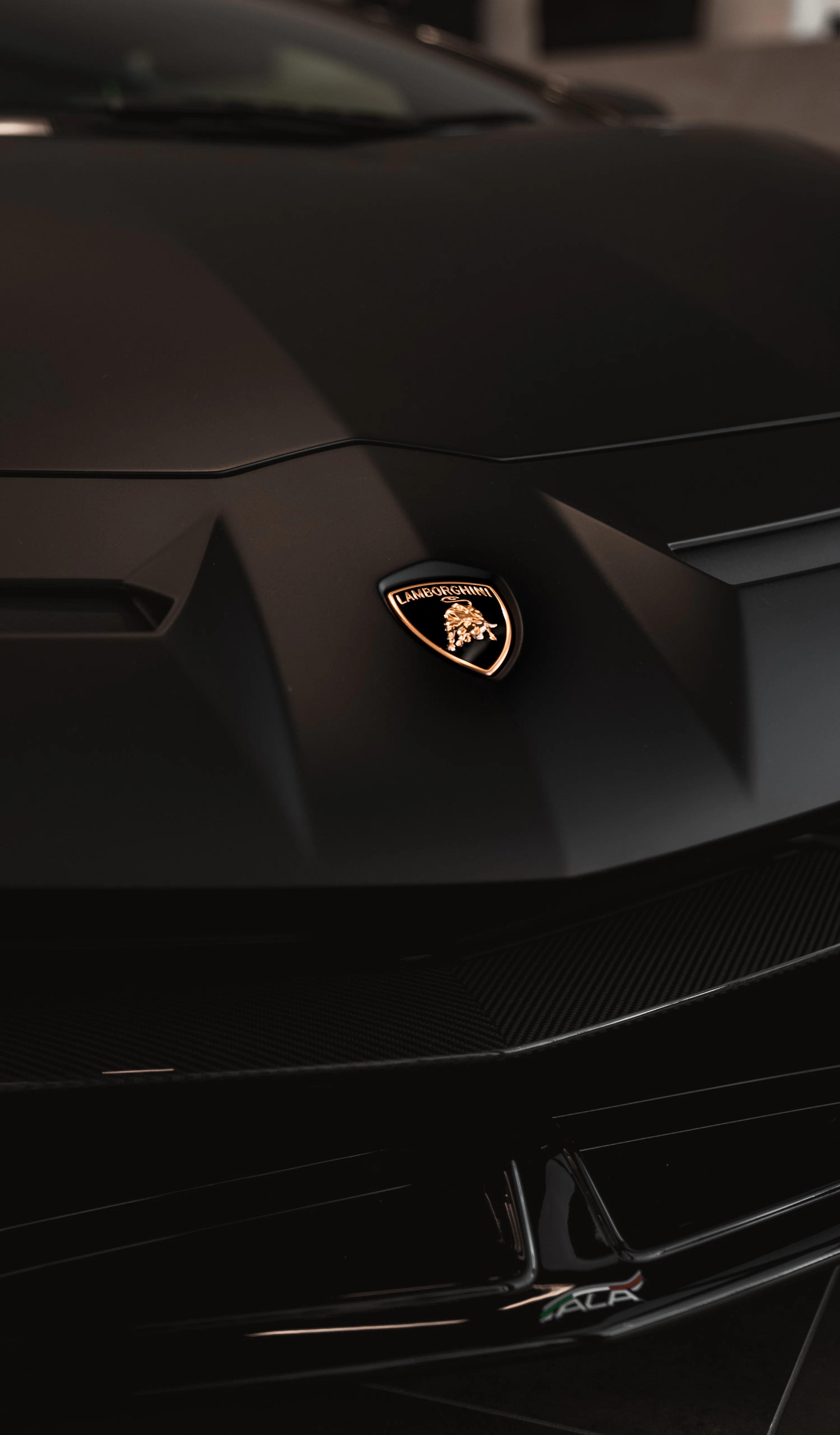 A close up of the front of a black sports car photo