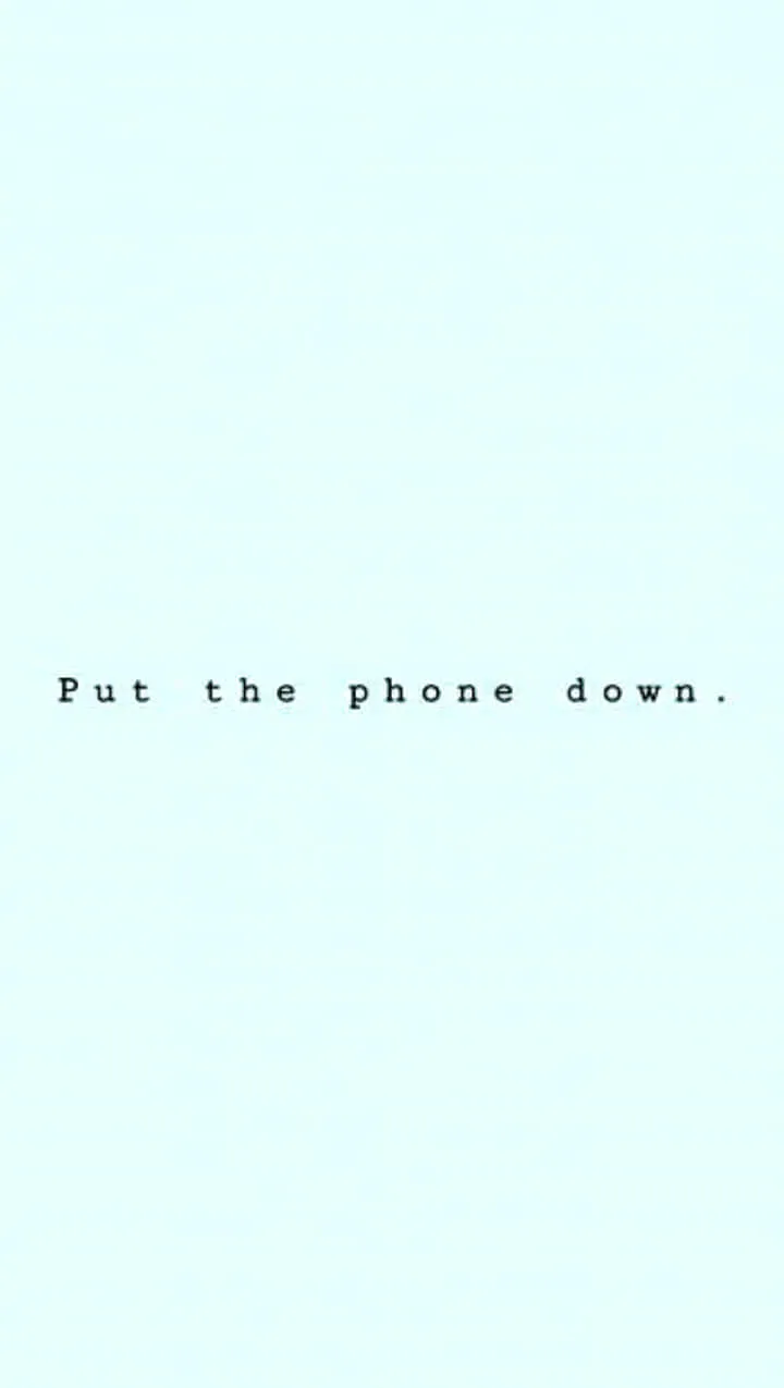 Download A Blue Background With The Words Put The Phone Down Wallpaper