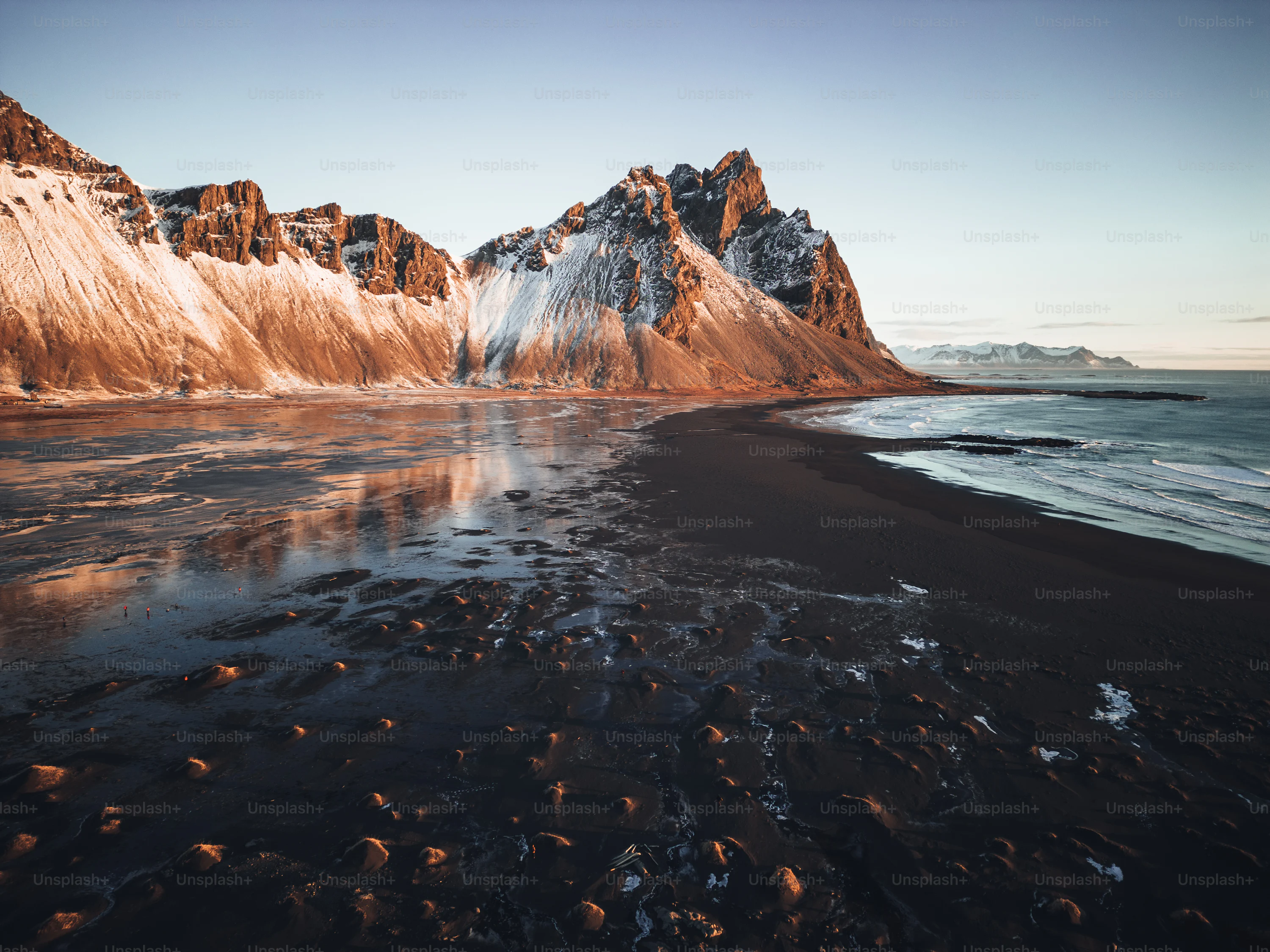 A beach with a mountain in the background photo