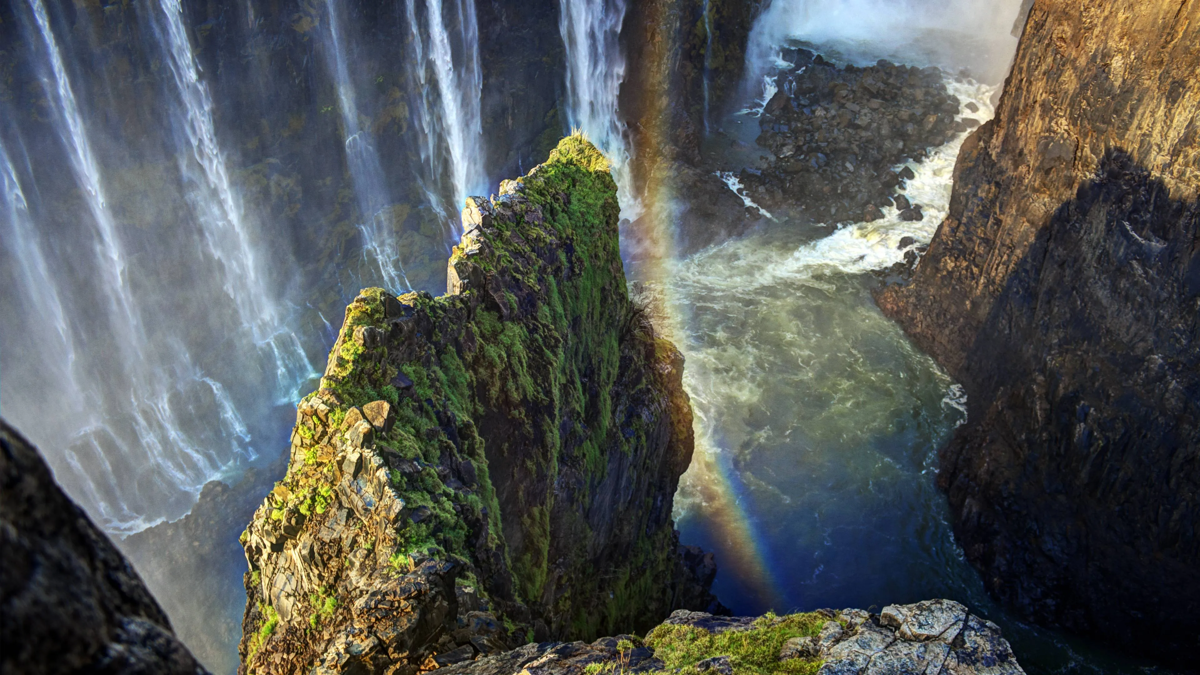 Wallpaper Green Moss on Brown Rock Formation Near Waterfalls During Daytime, Background Free Image