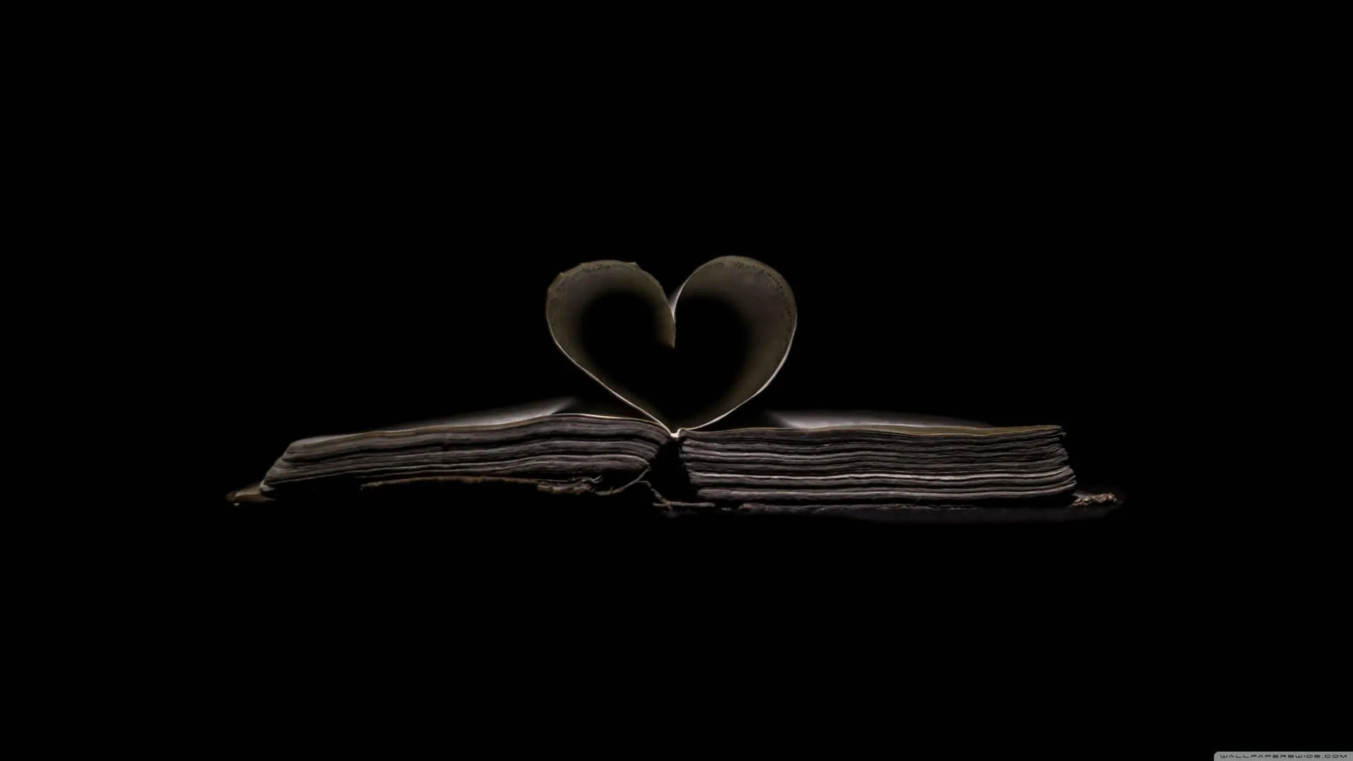Download Dark Heart From Old Book Pages Wallpaper