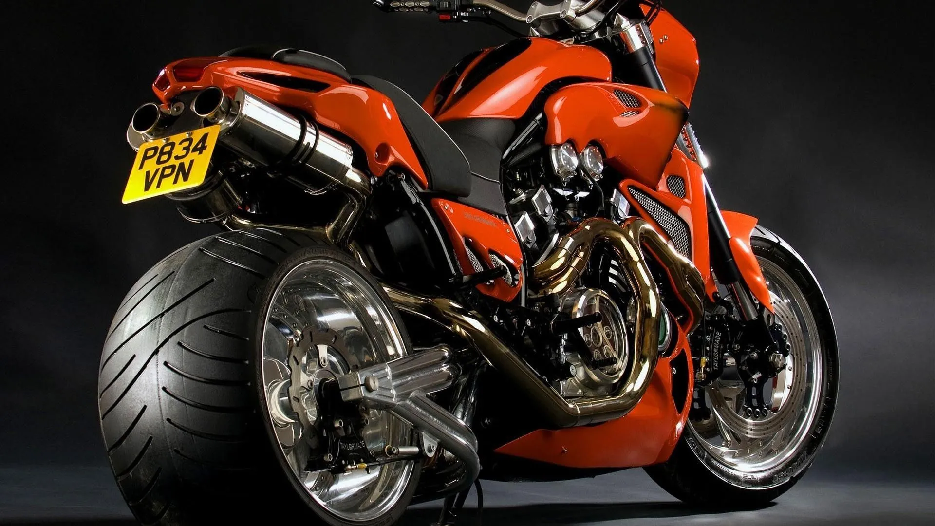 Black and red motorcycle on wide wheels