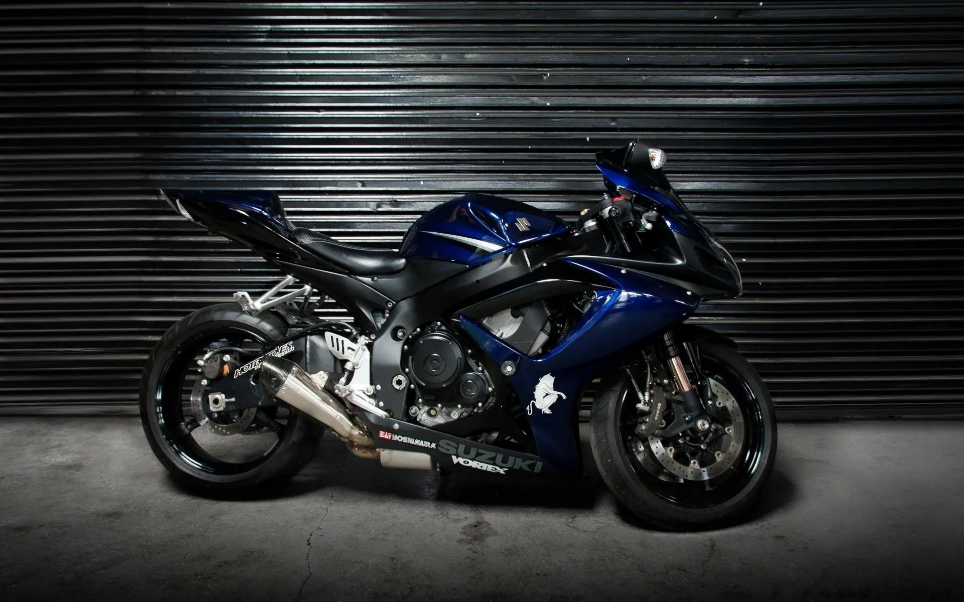 The bike is in the garage on a black background