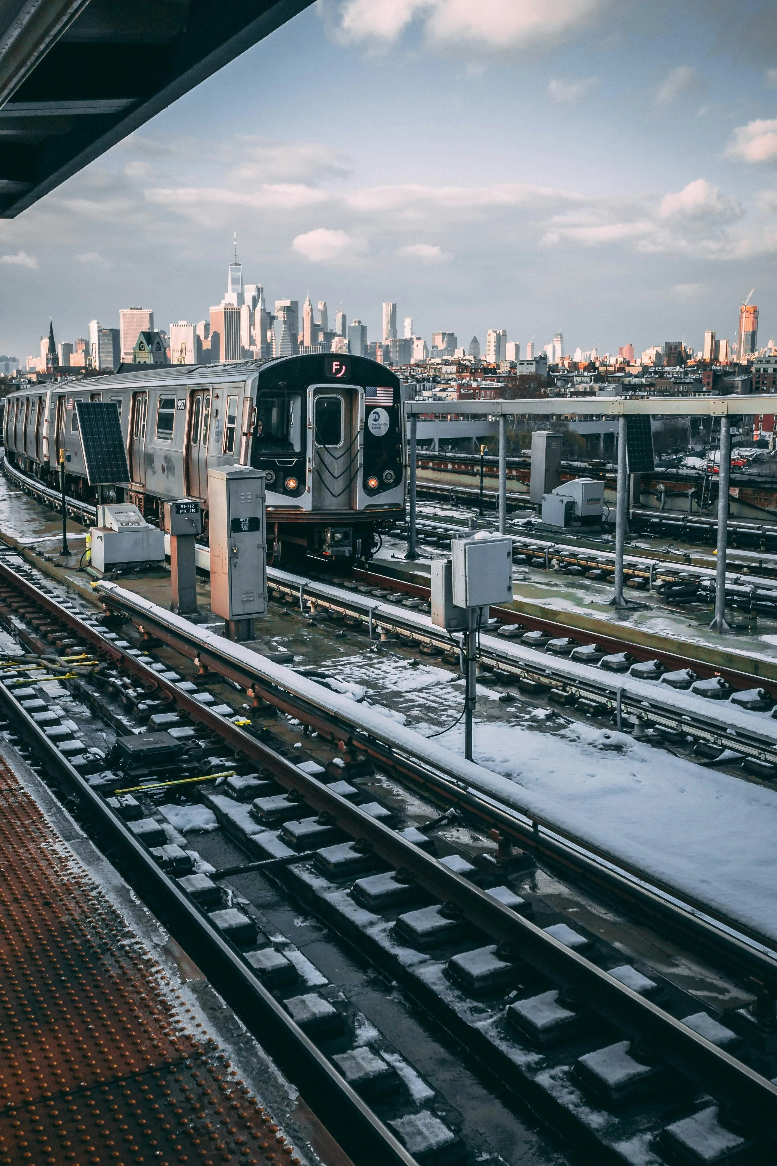 A train station with a city in the background photo