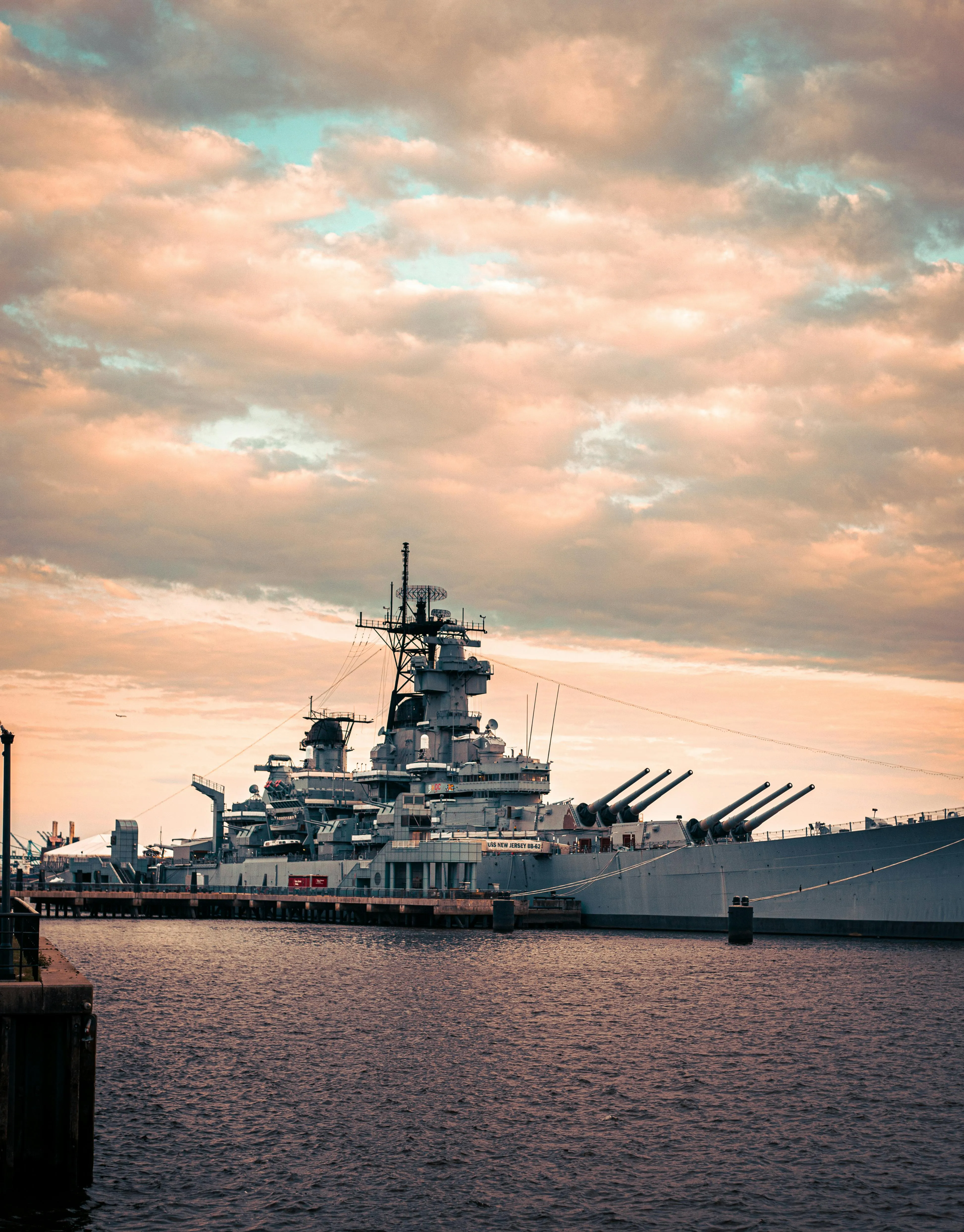 Warship in a Dock at Sunset · Free
