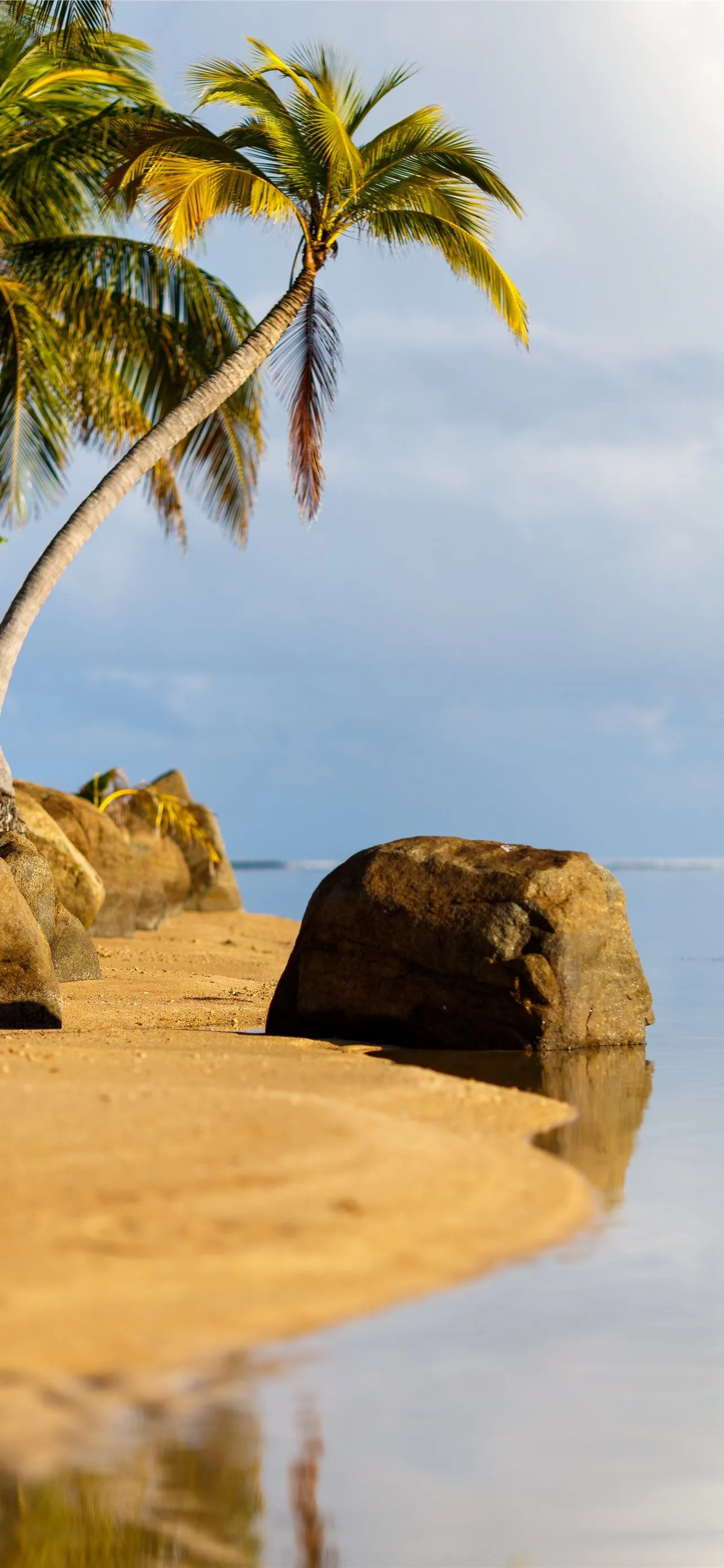 Smooth seas at one of the many beautiful tropical. iPhone Wallpaper Free Download
