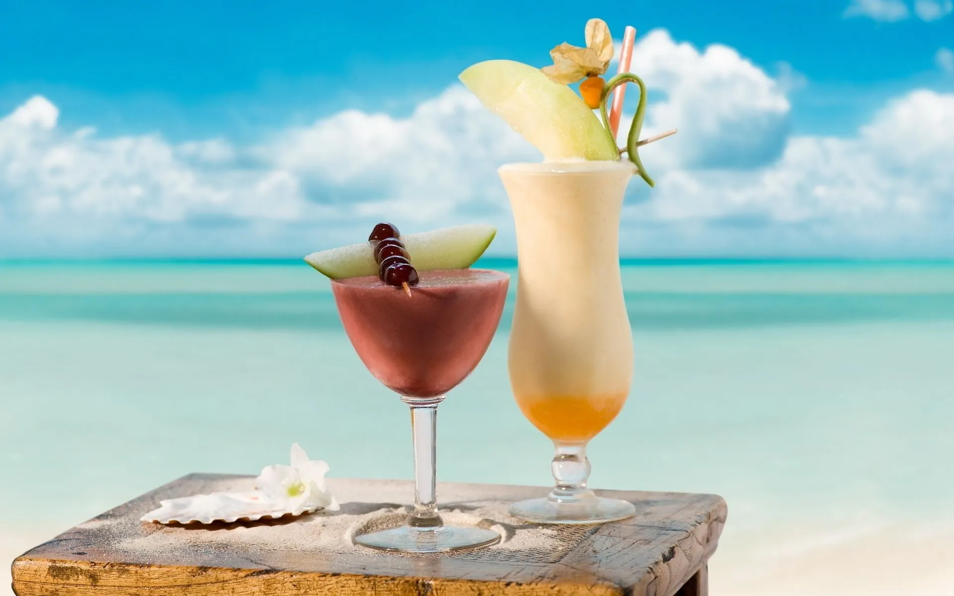 Tropical cocktail on the background of the sea and the sun