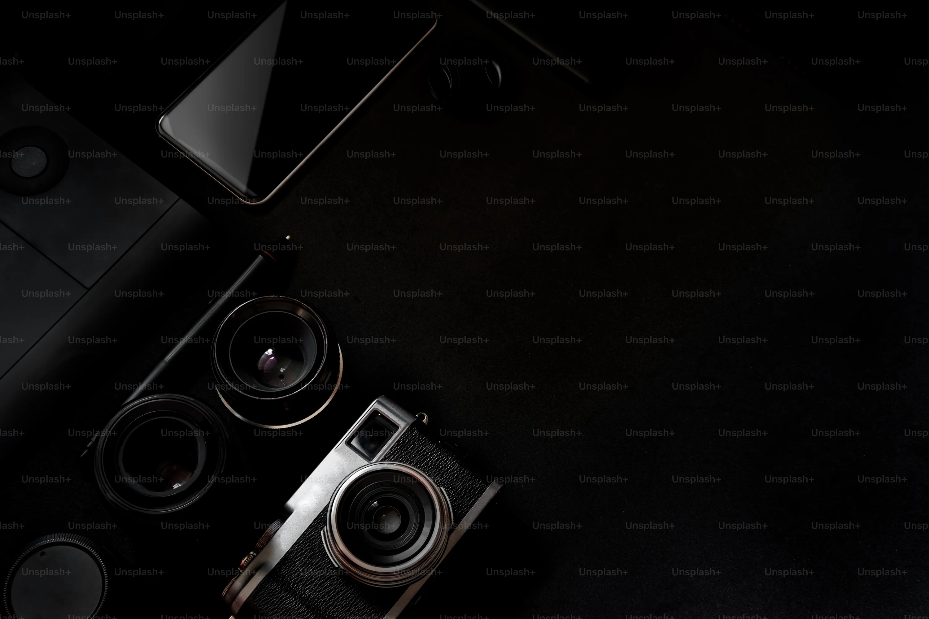 A close up of a camera with a black background photo