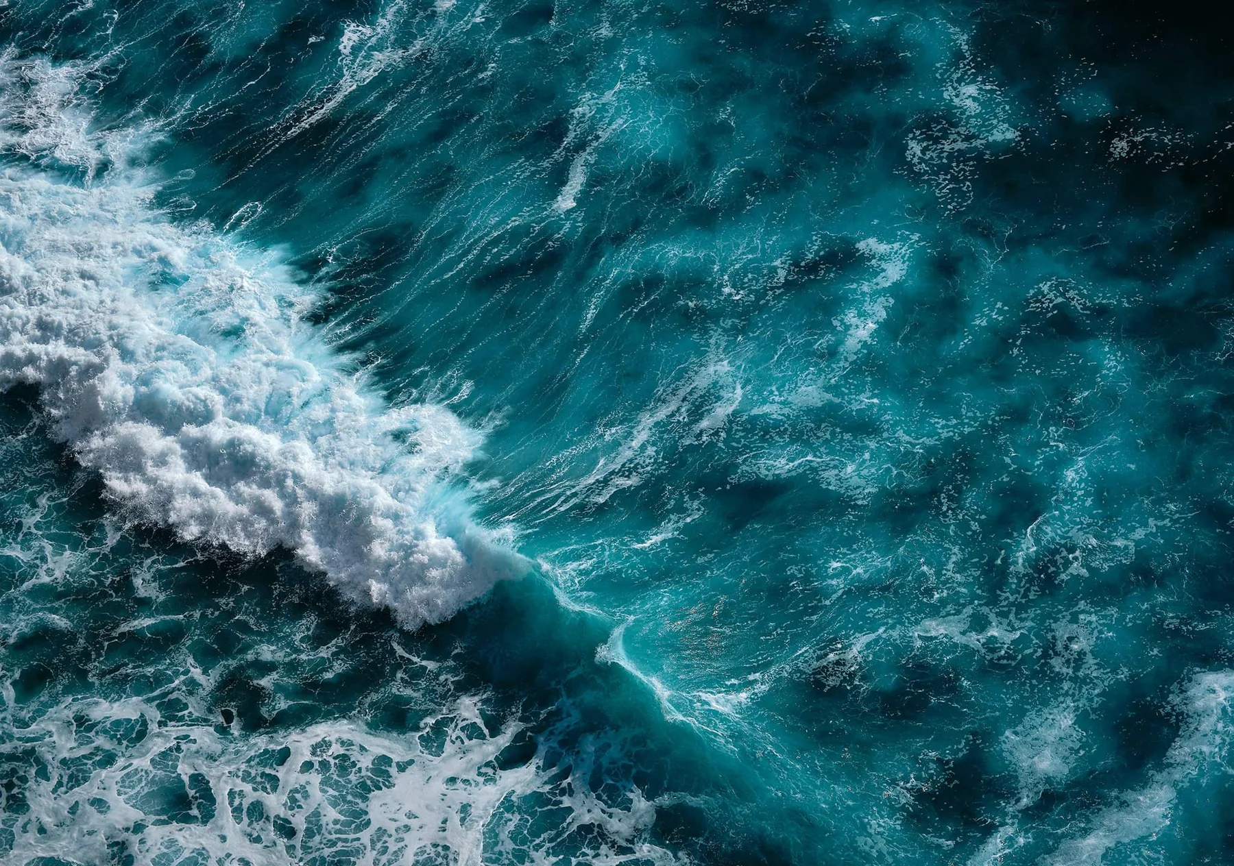 Deep teal aerial ocean wave Wall Mural
