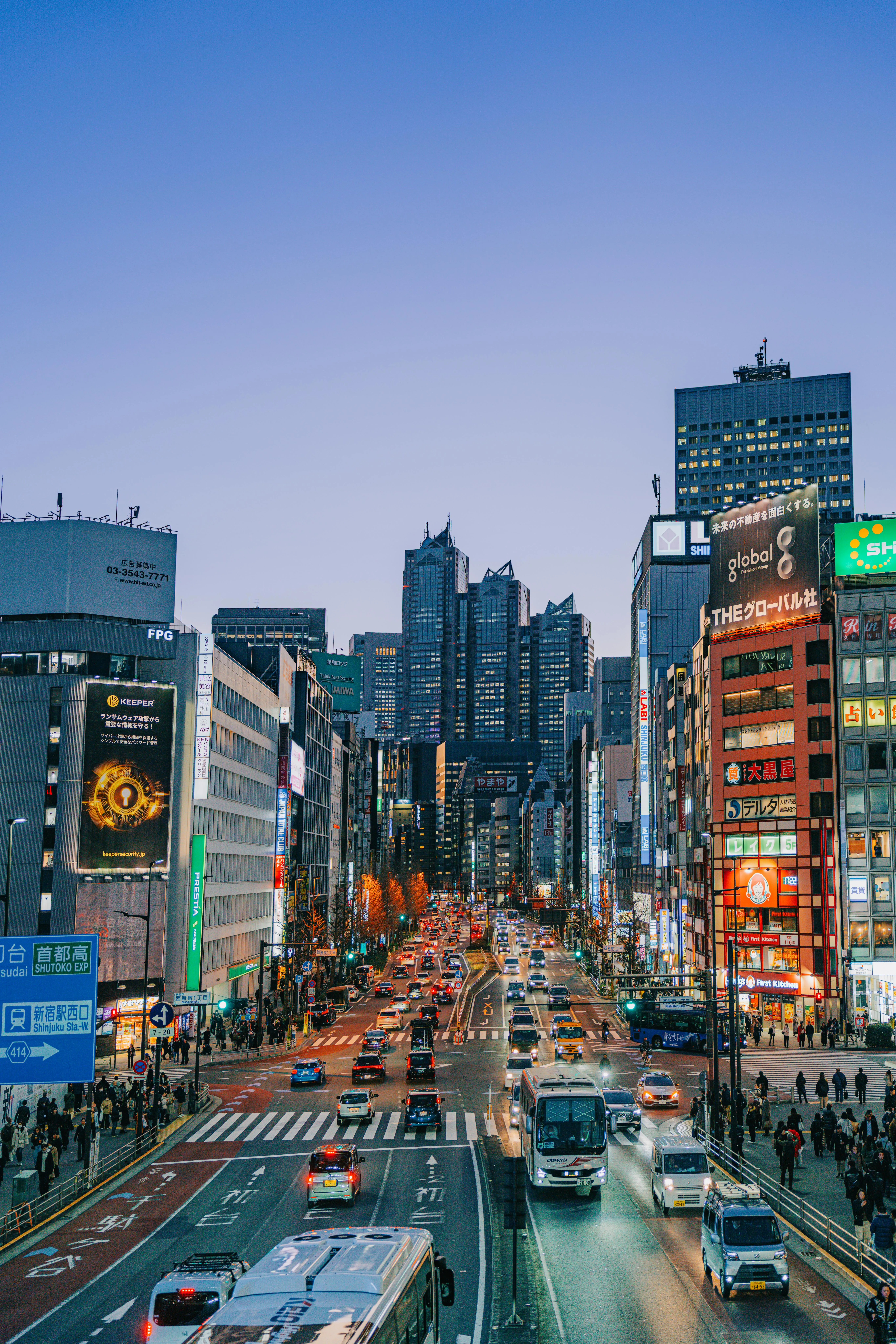 Busy Urban Street with Skyscrapers in Tokyo · Free