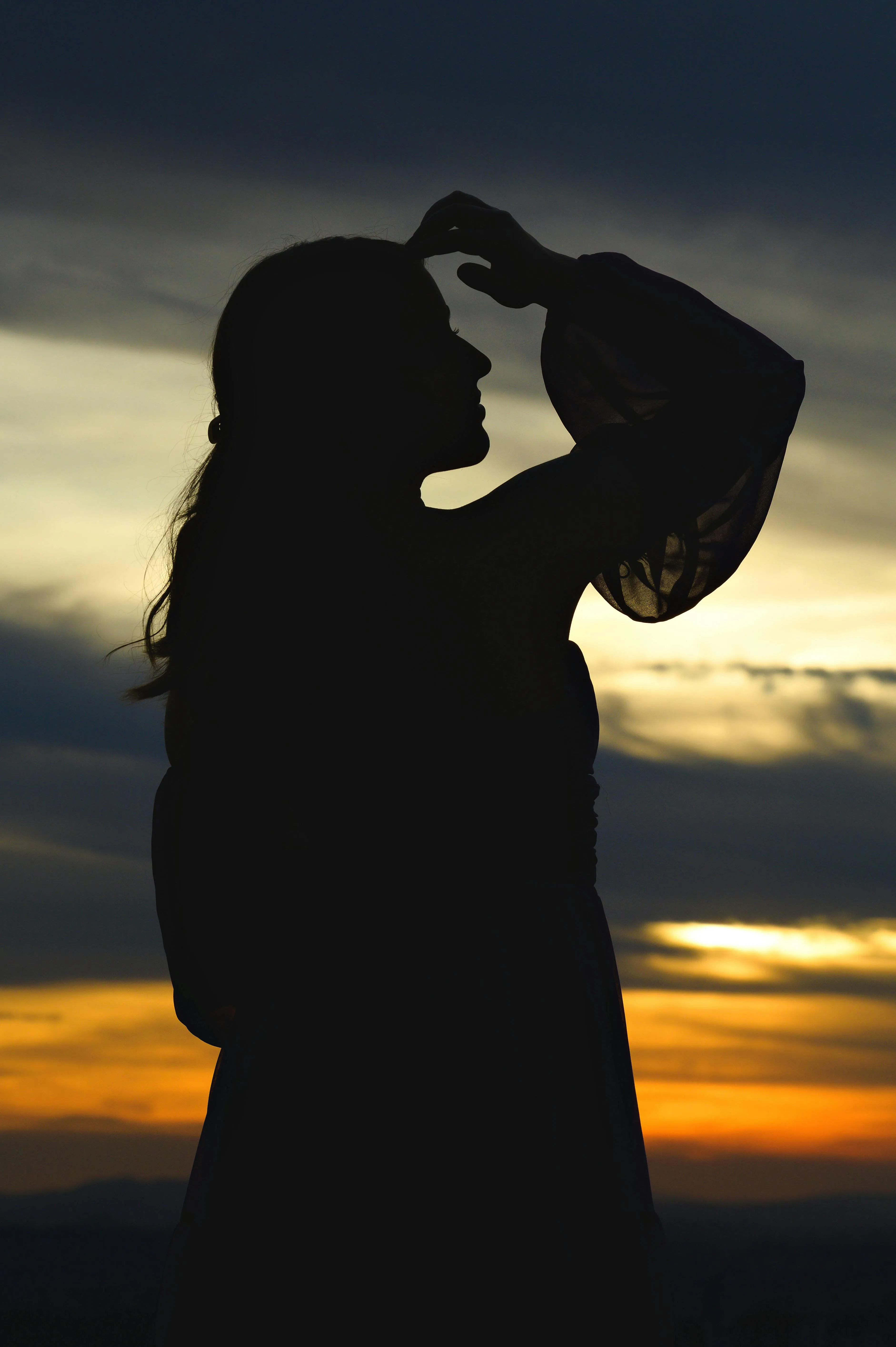Silhouette of Woman in Hijab at Sunset · Free