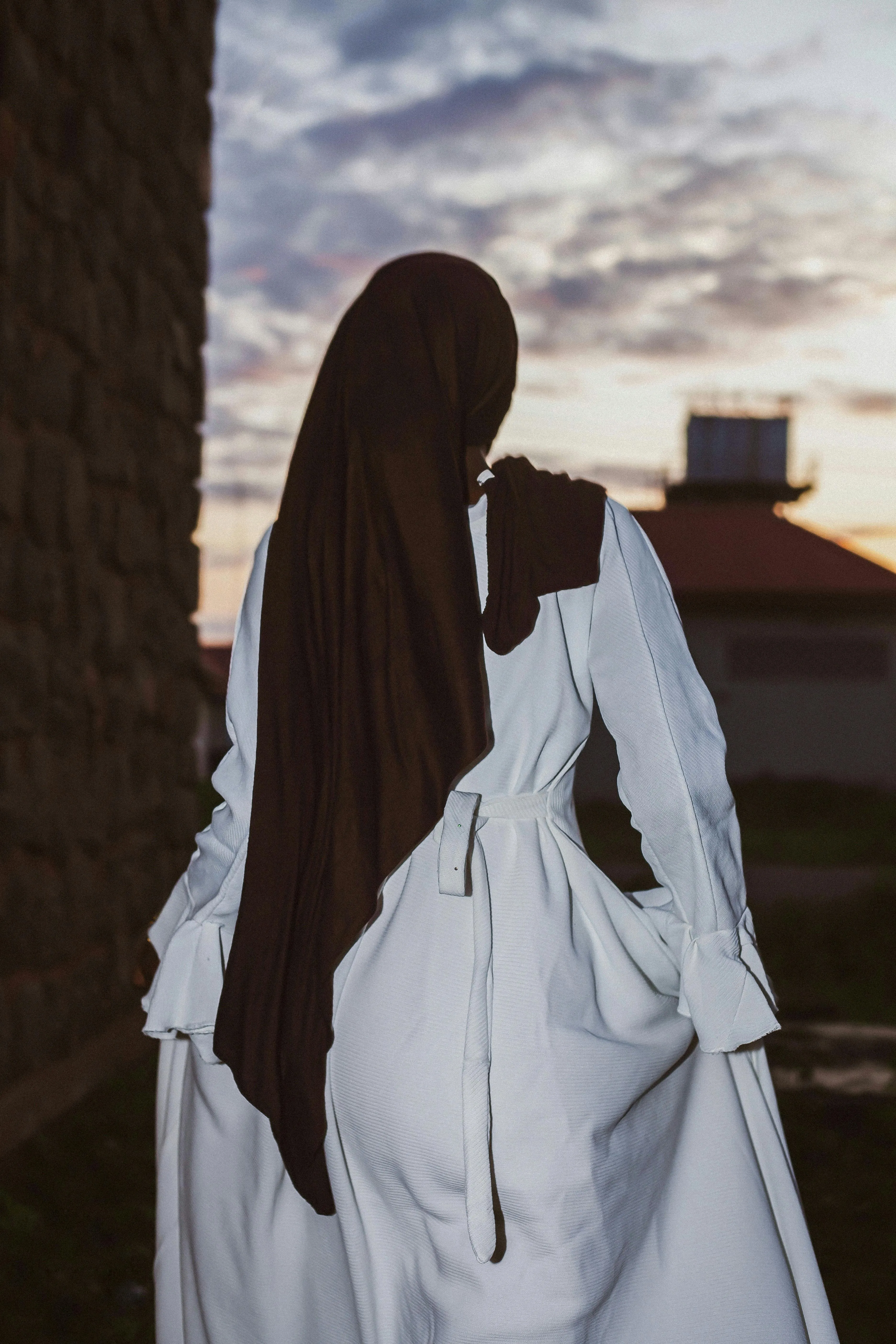 Woman in Hijab Walking at Sunset · Free
