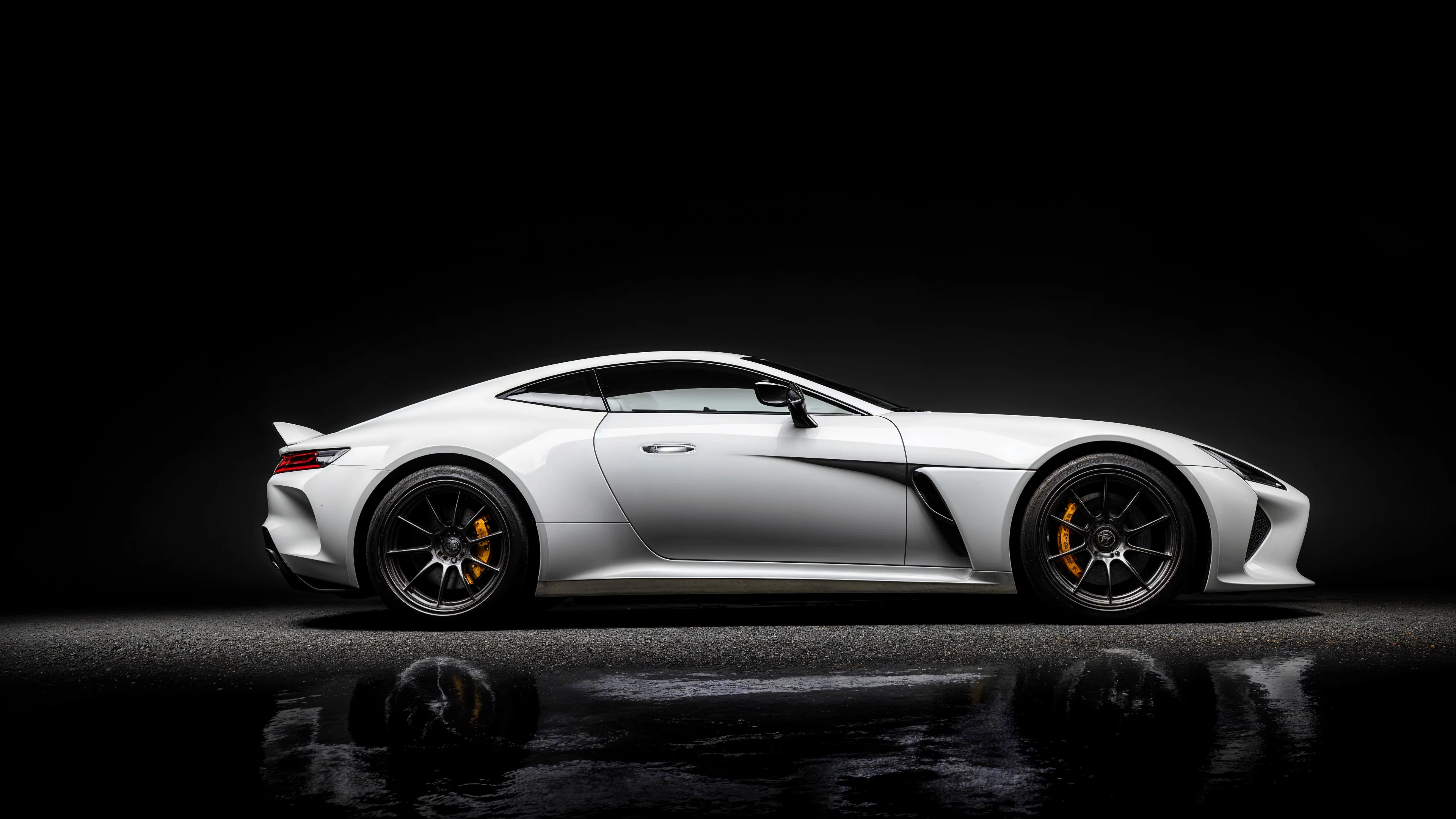 White sports car on a black background Wallpaper 4k for Desktop