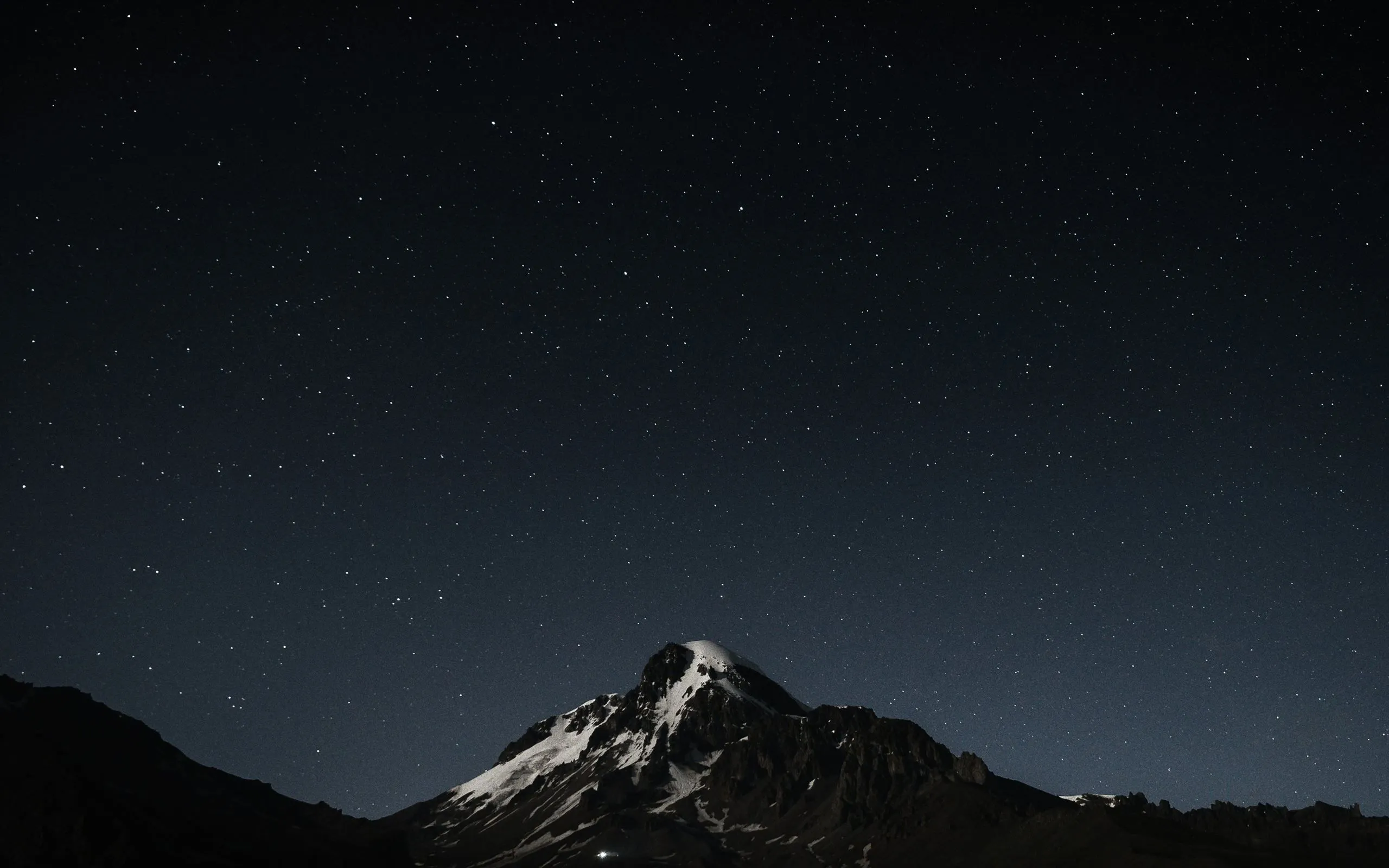 The night sky with stars above a mountain MacBook Air Wallpaper Download
