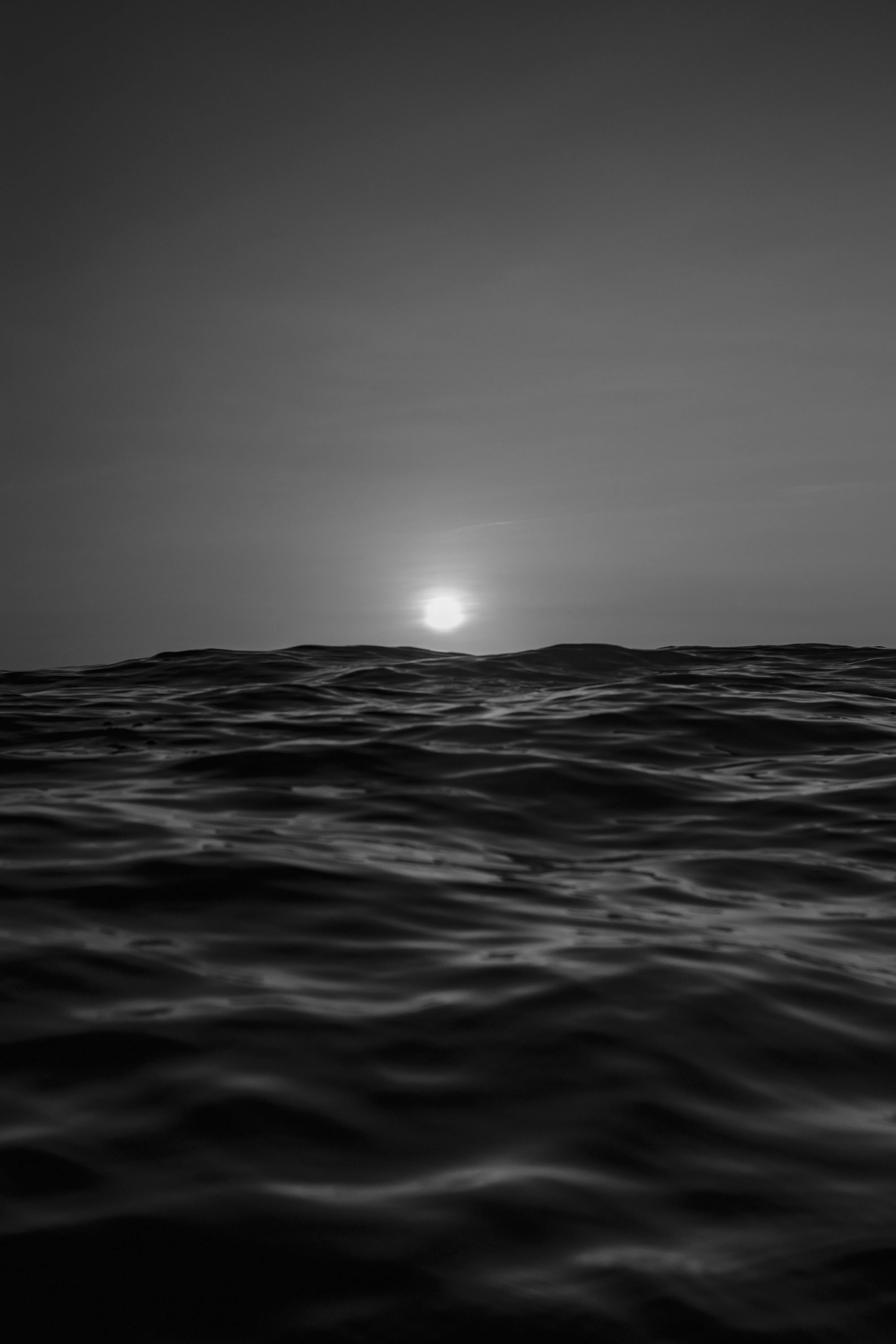 Grayscale Photo of Ocean Waves with View of Moon · Free