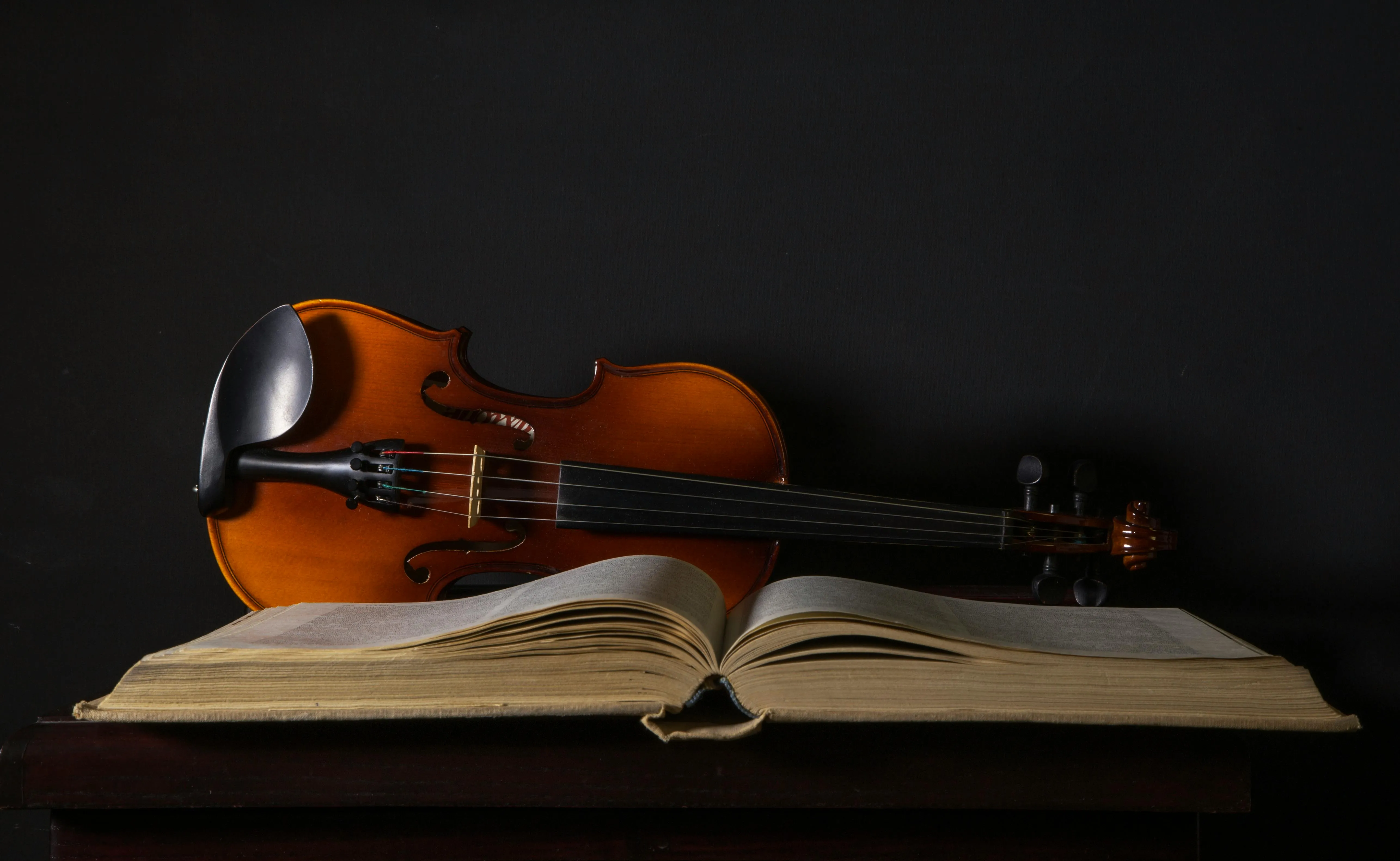 Violin Beside a Music Sheets · Free
