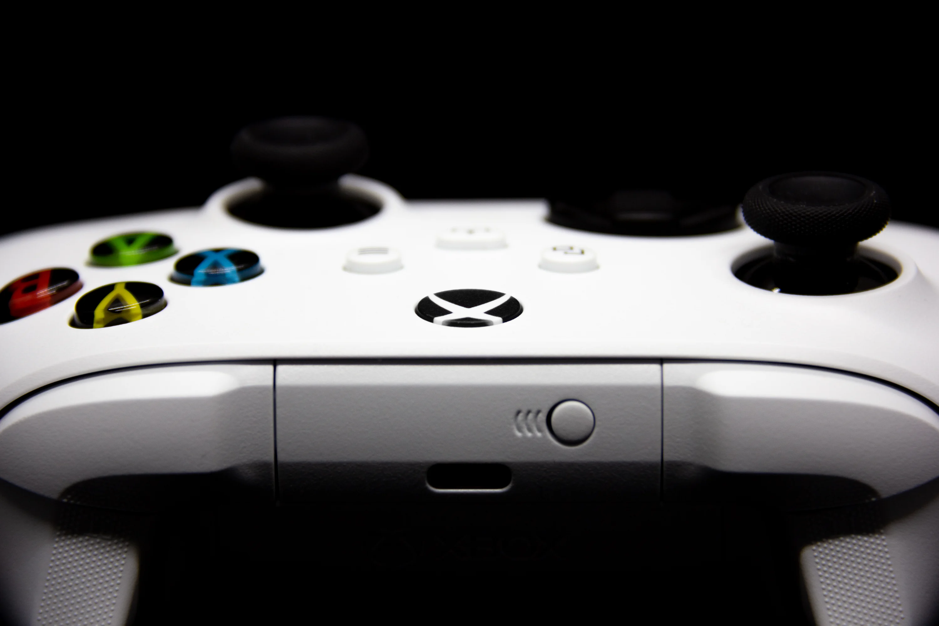 A close up of a video game controller photo