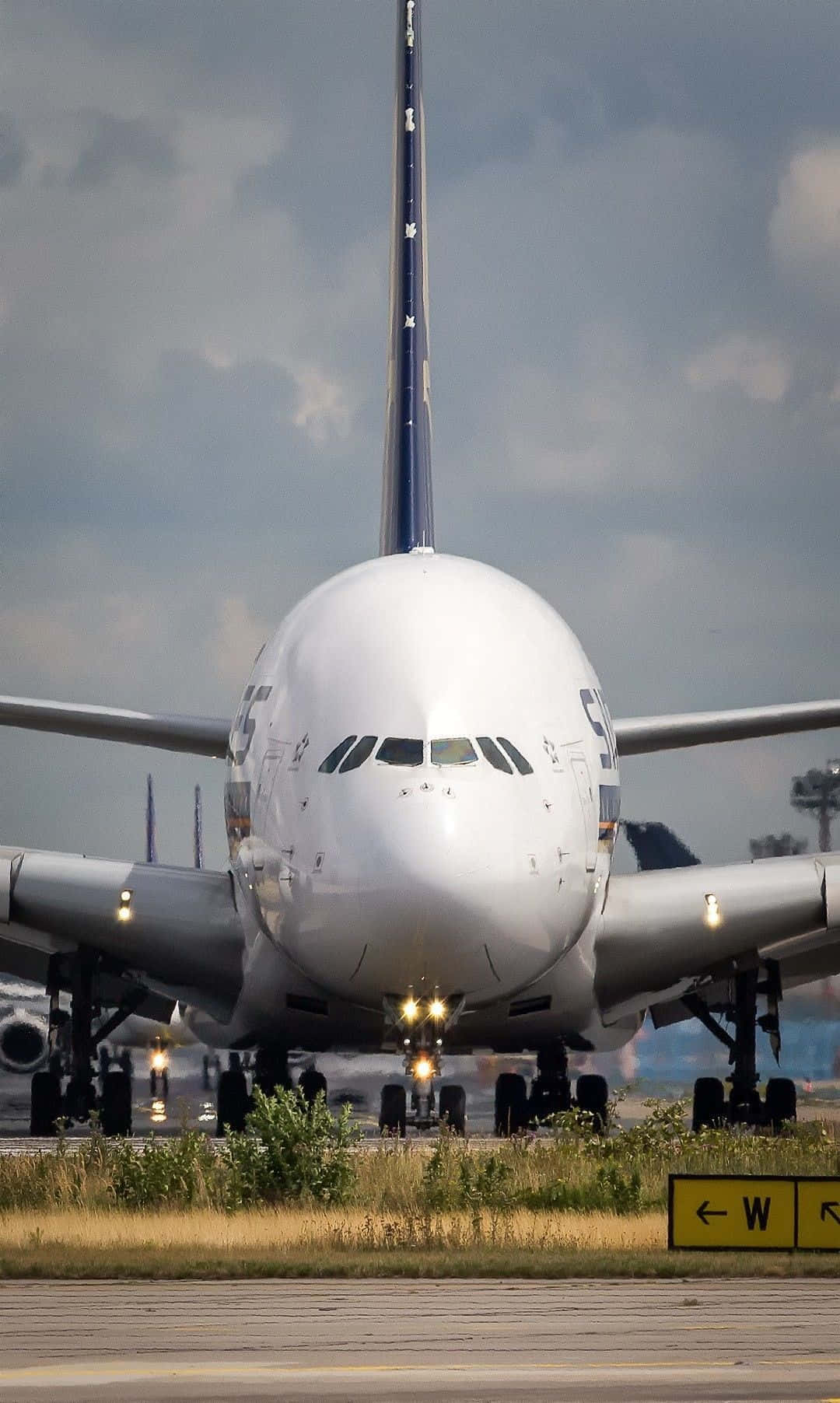 Download Airbus A380 Frontal View On Runway Wallpaper
