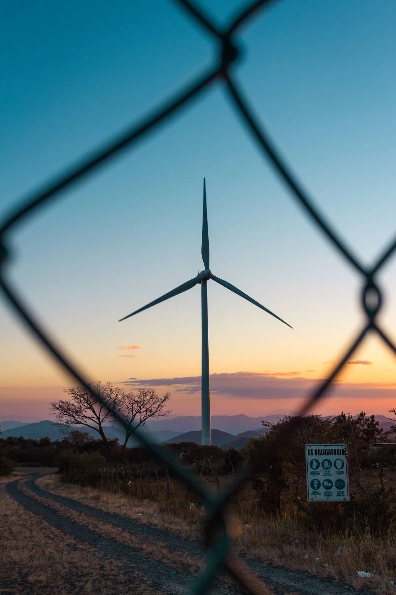 Download Windmill And Sky In Honduras Wallpaper