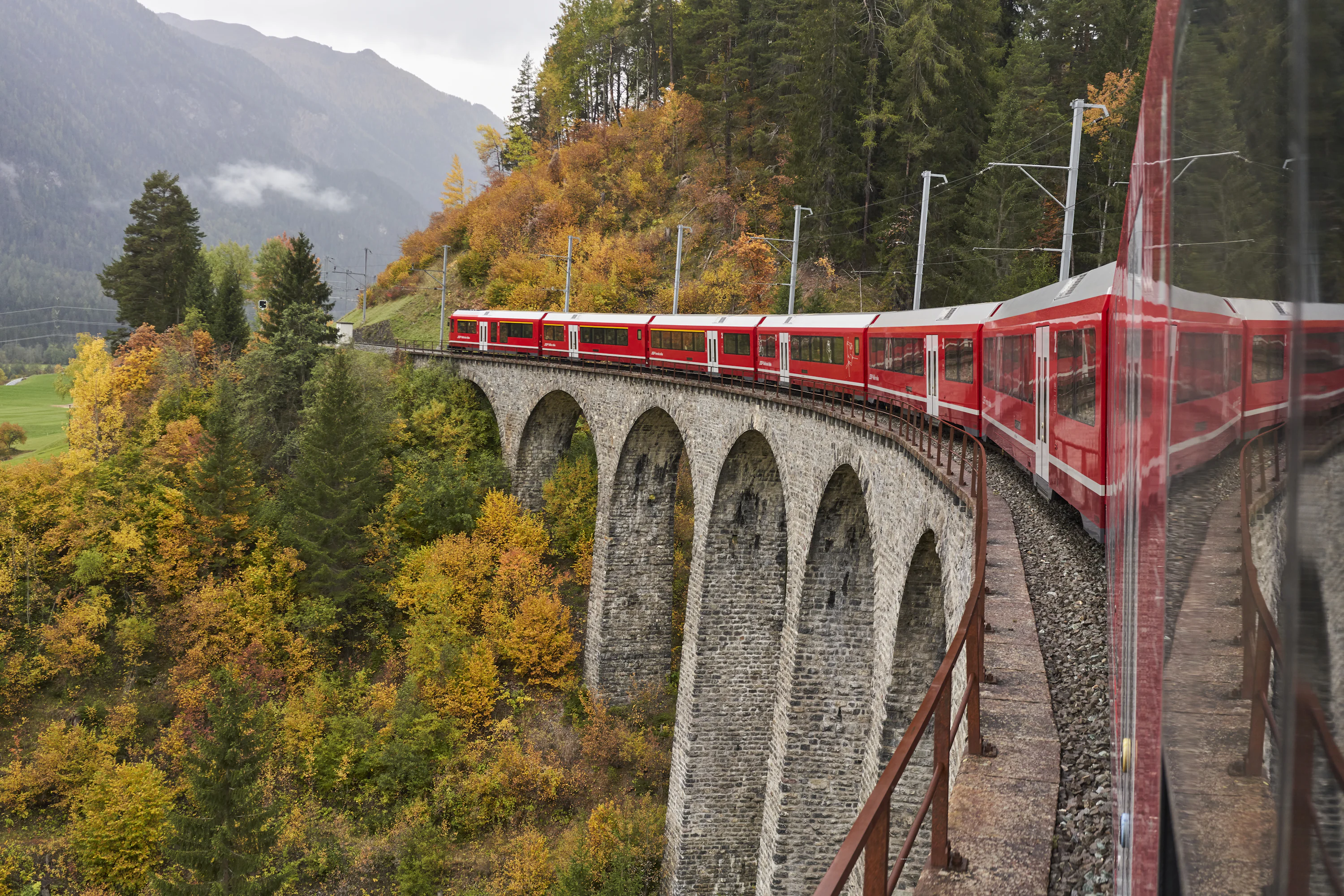 Red train on rail photo