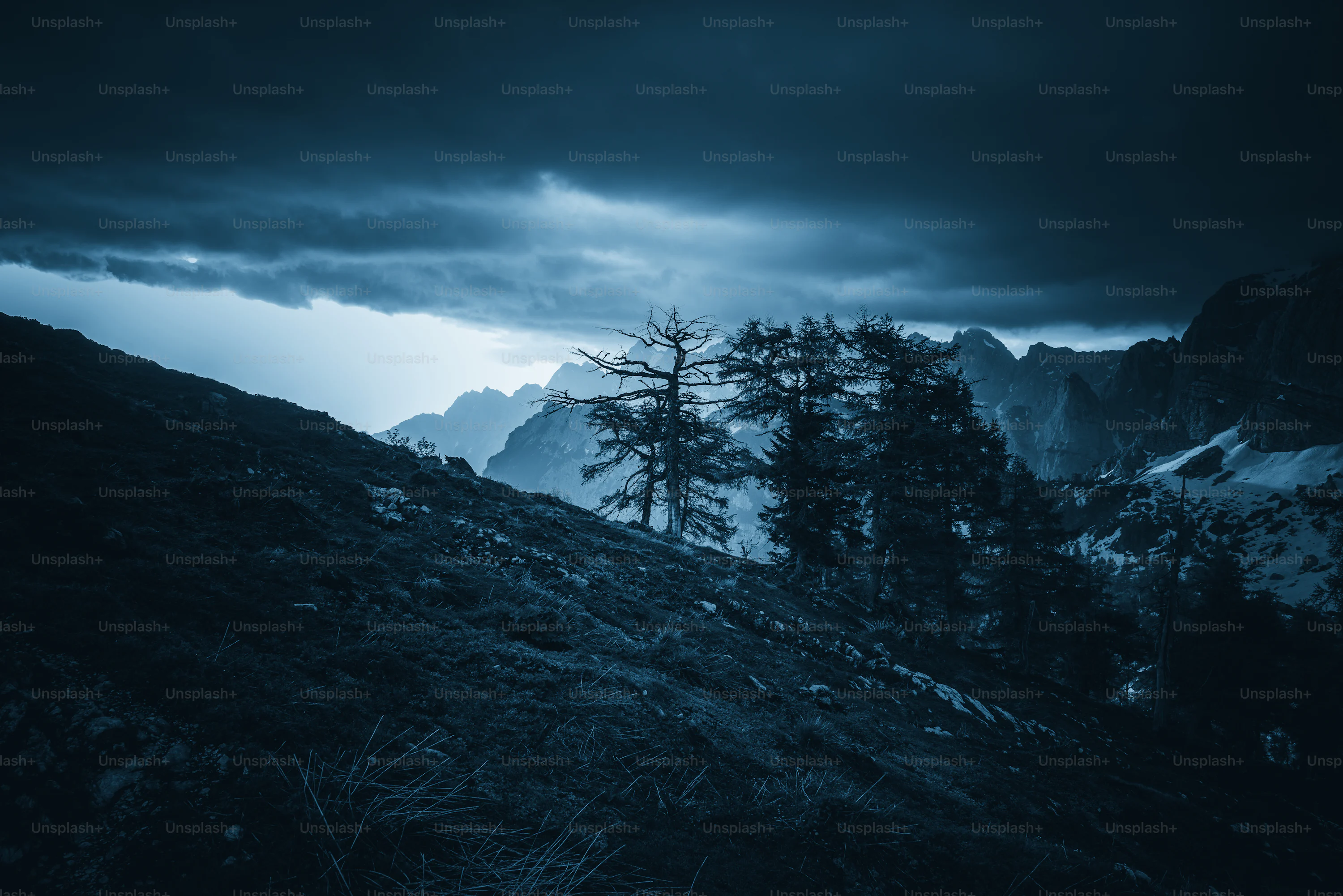 A black and white photo of a dark mountain photo