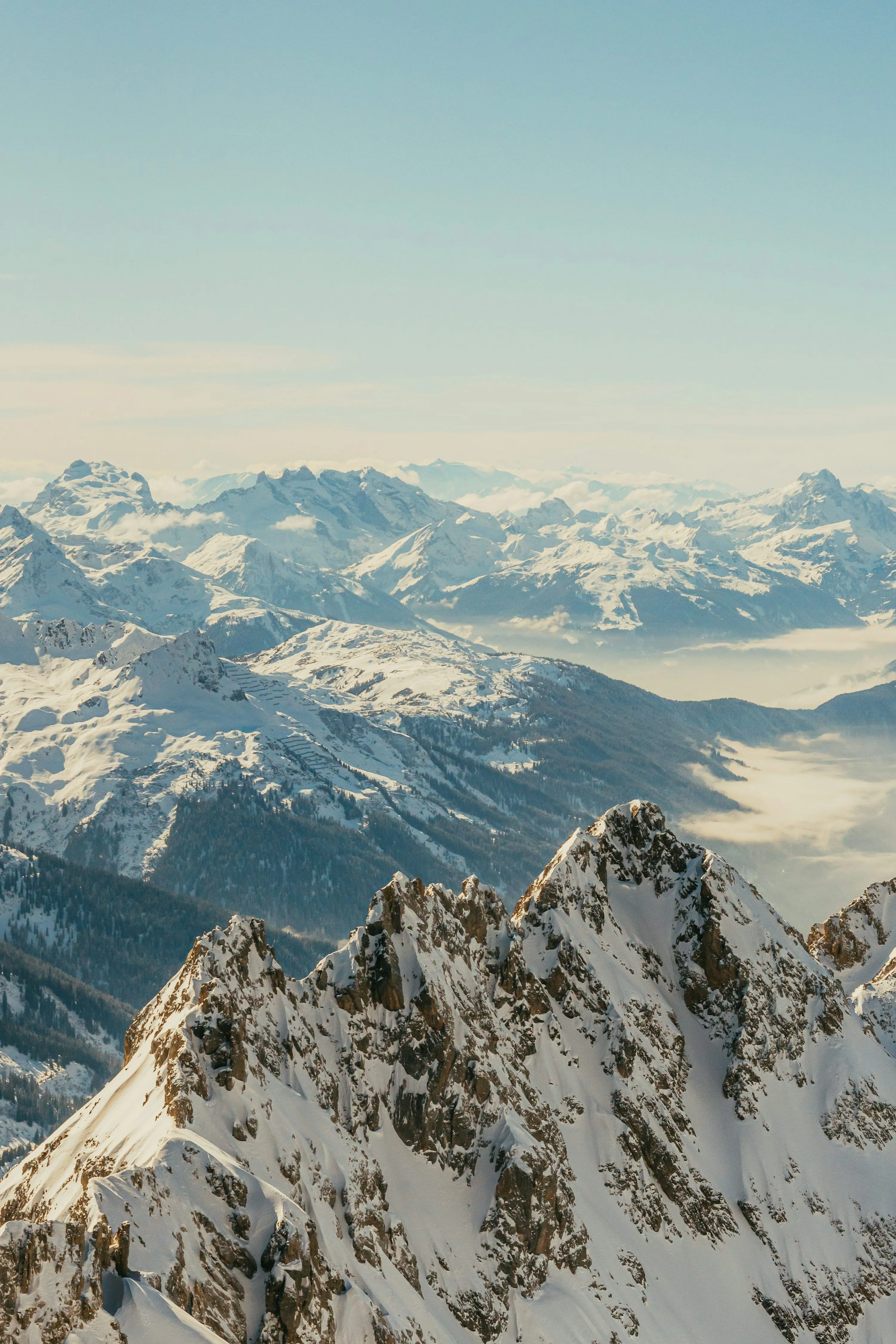 A view of a mountain range covered in snow photo