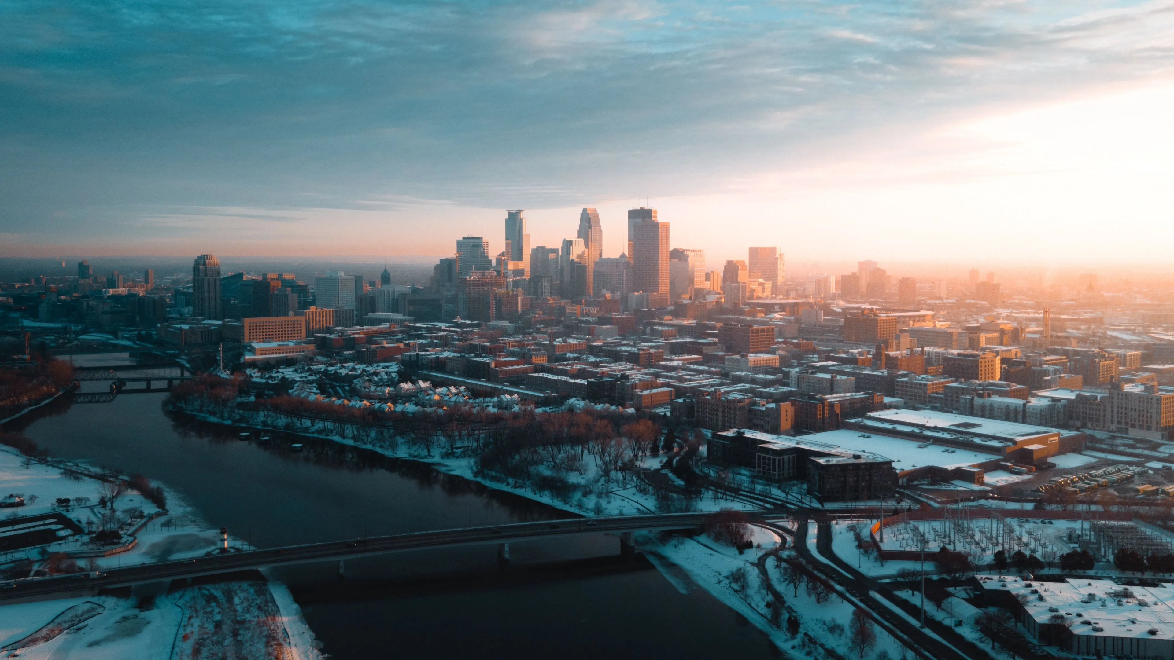 Download wallpaper 3840x2160 city, aerial view, buildings, river, bridge, winter 4k uhd 16:9 HD background