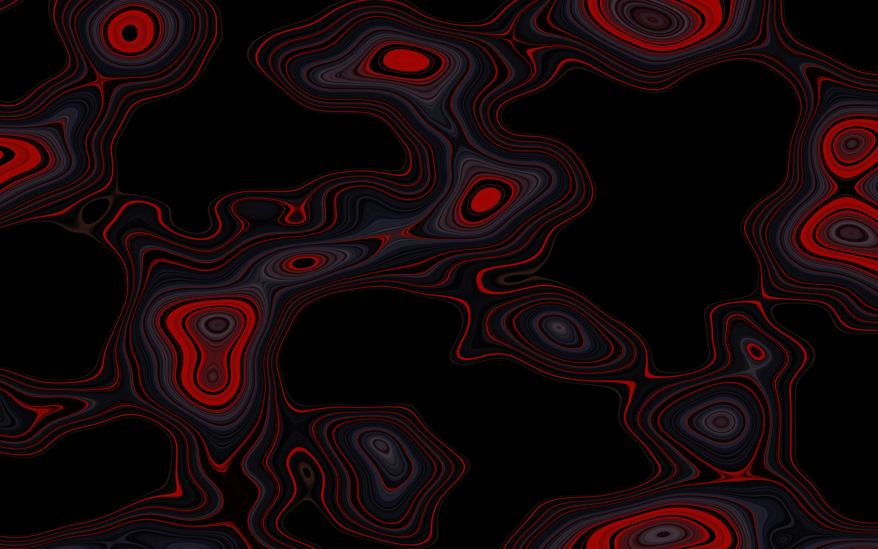 A black background with red and black swirls photo