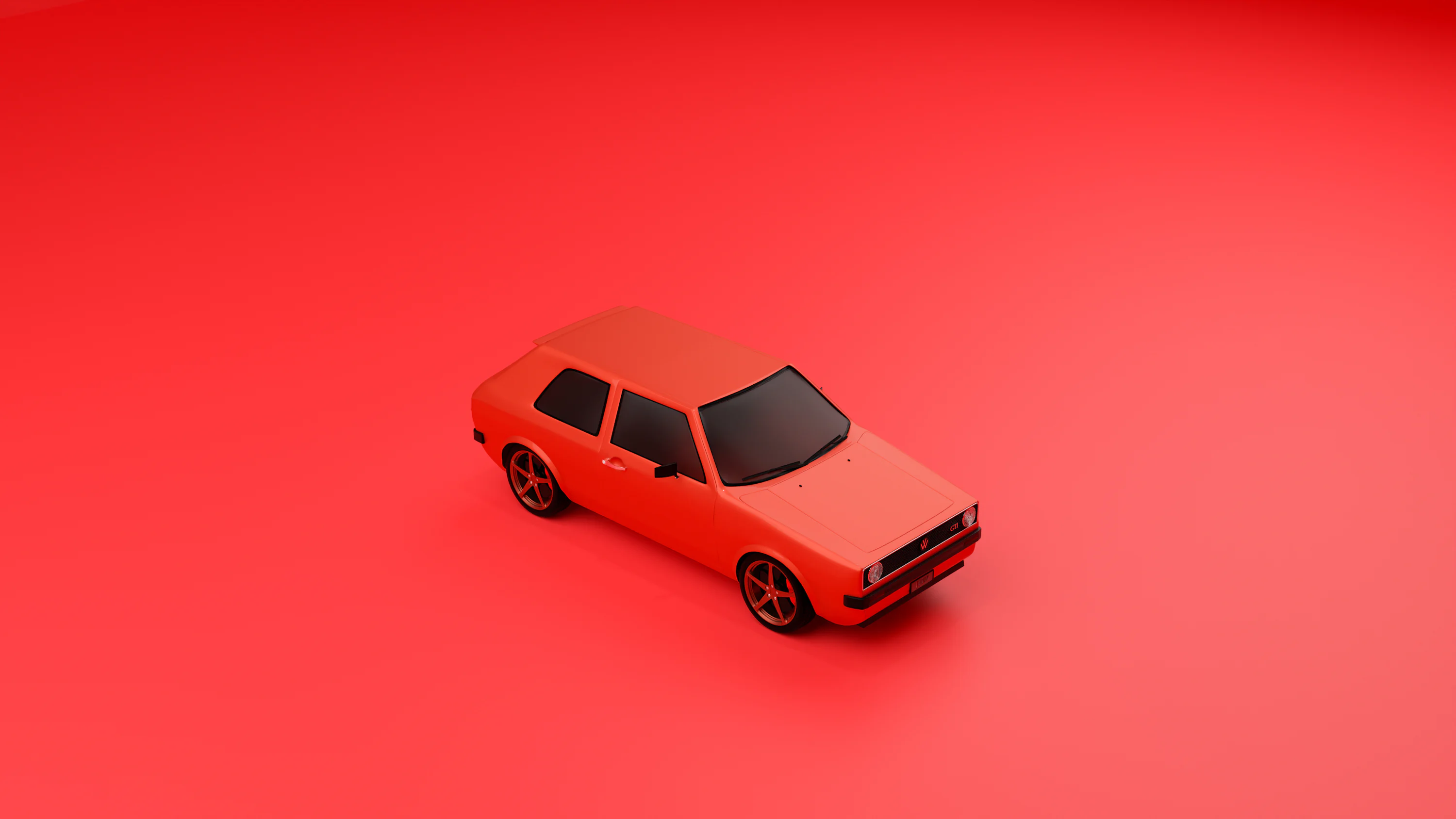 A red toy car on a red background photo