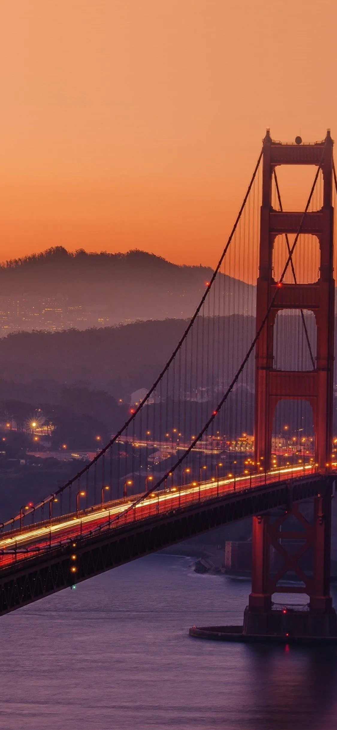 iPhone X wallpaper. bridge orange sunset river city lights