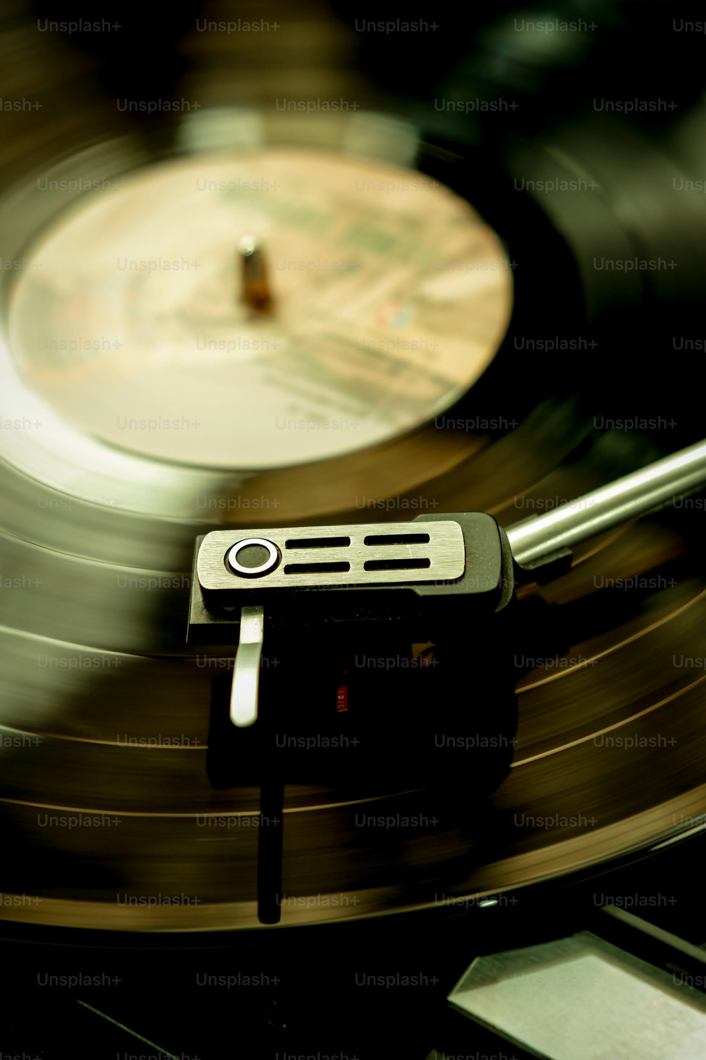 Turntable needle on spinning vinyl record photo