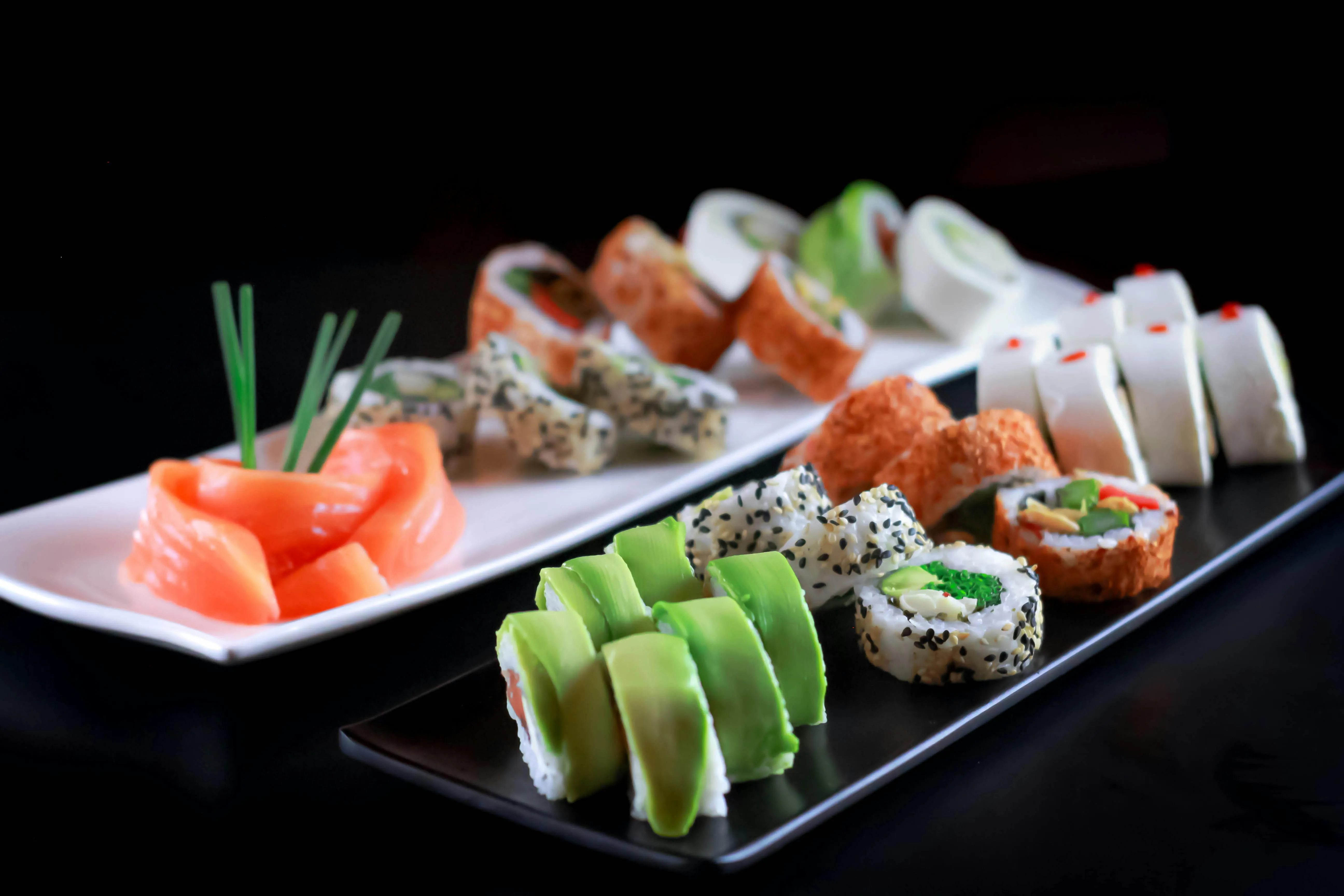 Sushi and Sashimi on Ceramic Plates · Free