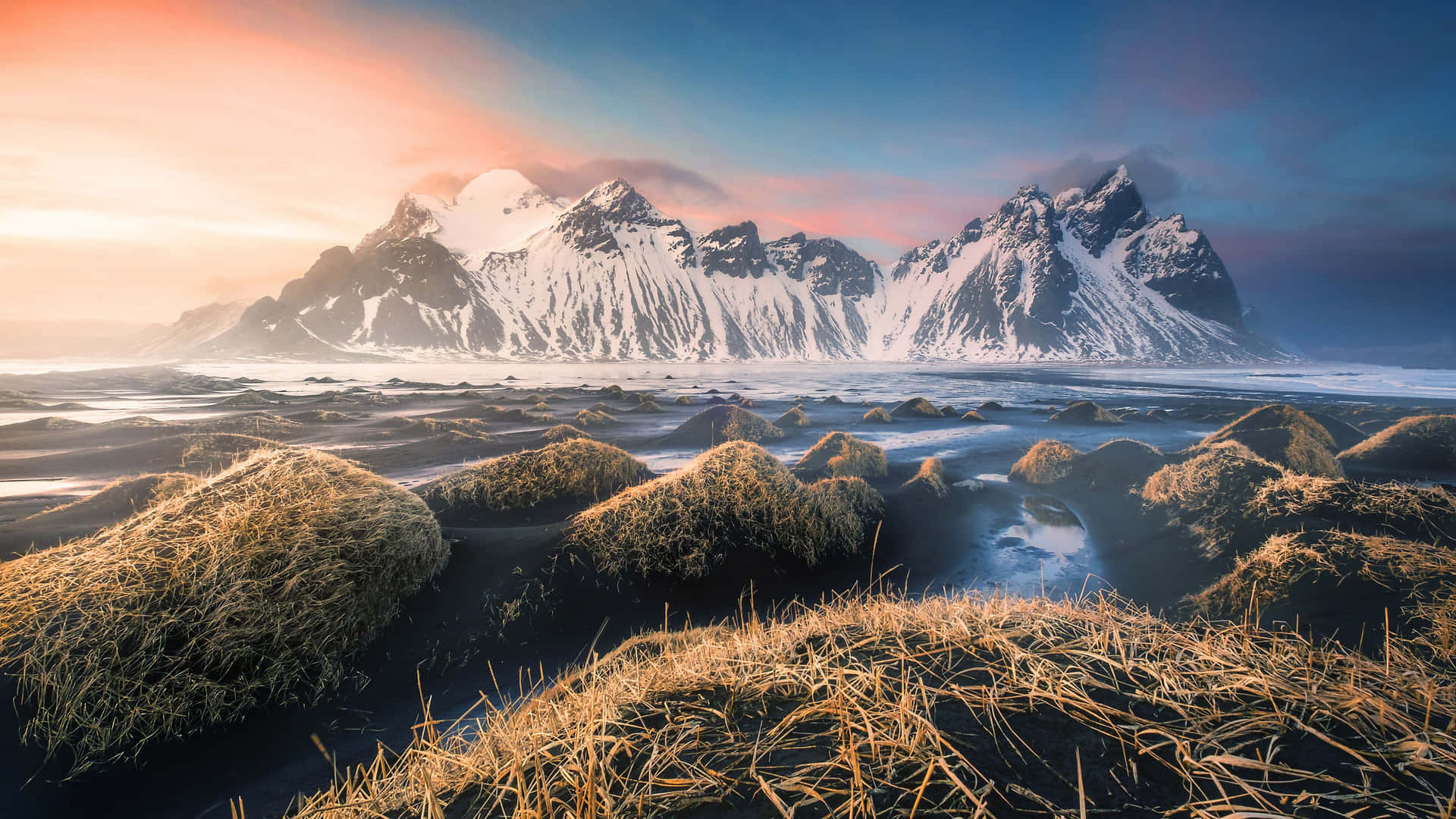 Download A breathtaking vista of Iceland's majestic glaciers and cliffs Wallpaper