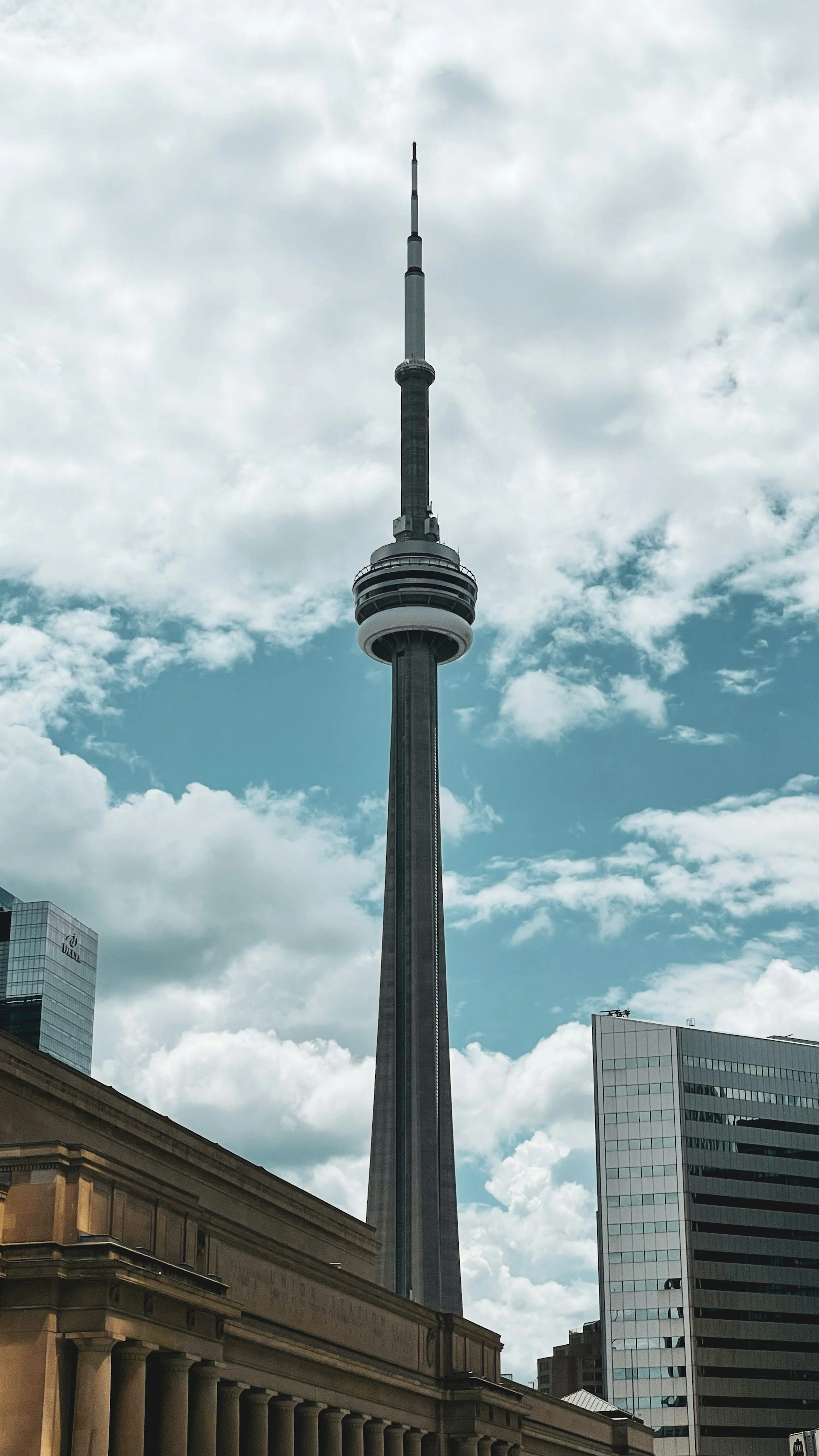 Black tower under blue sky and white clouds during daytime photo