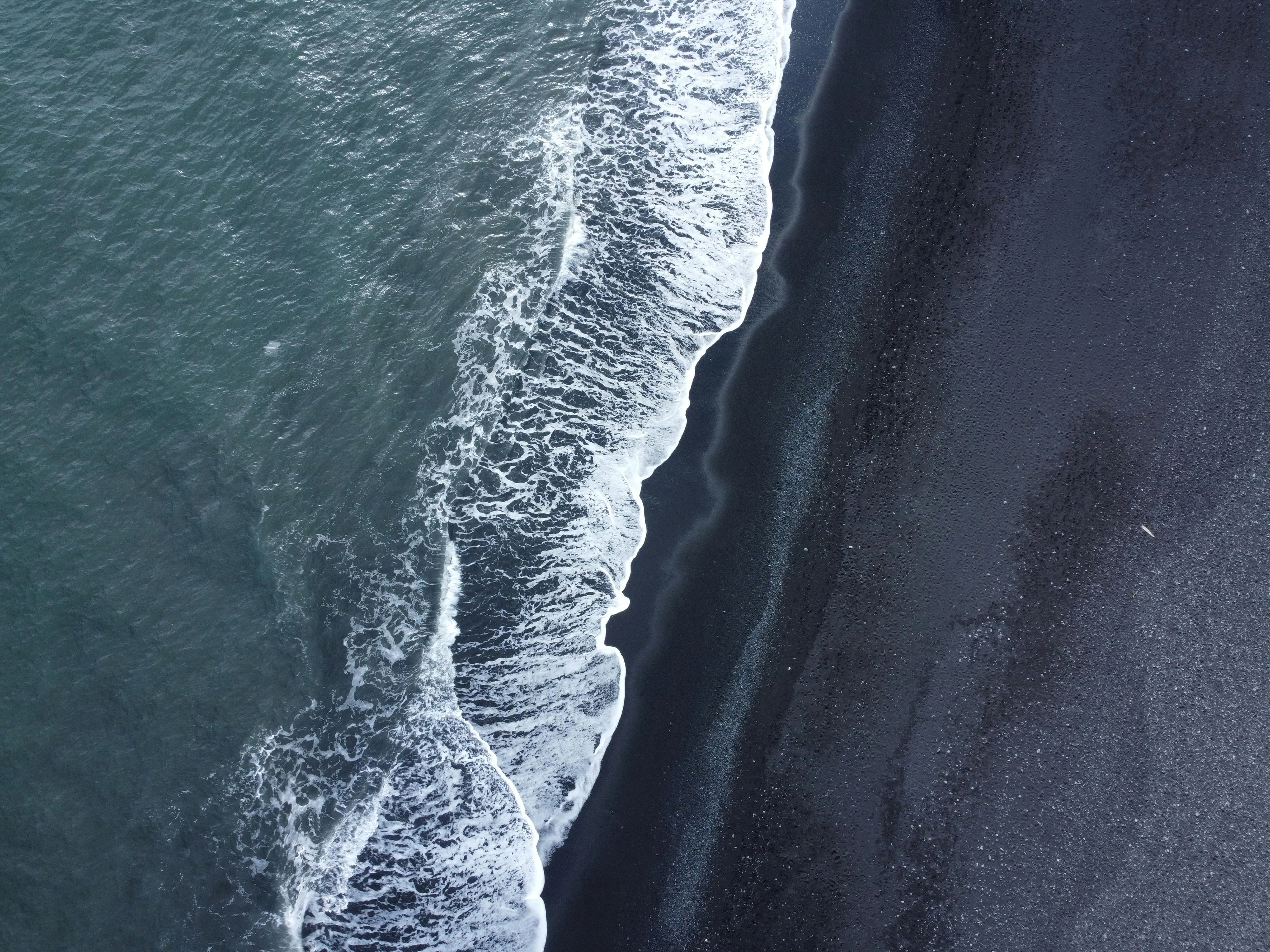 Aerial View of Waves on Black Sand Beach in Iceland · Free