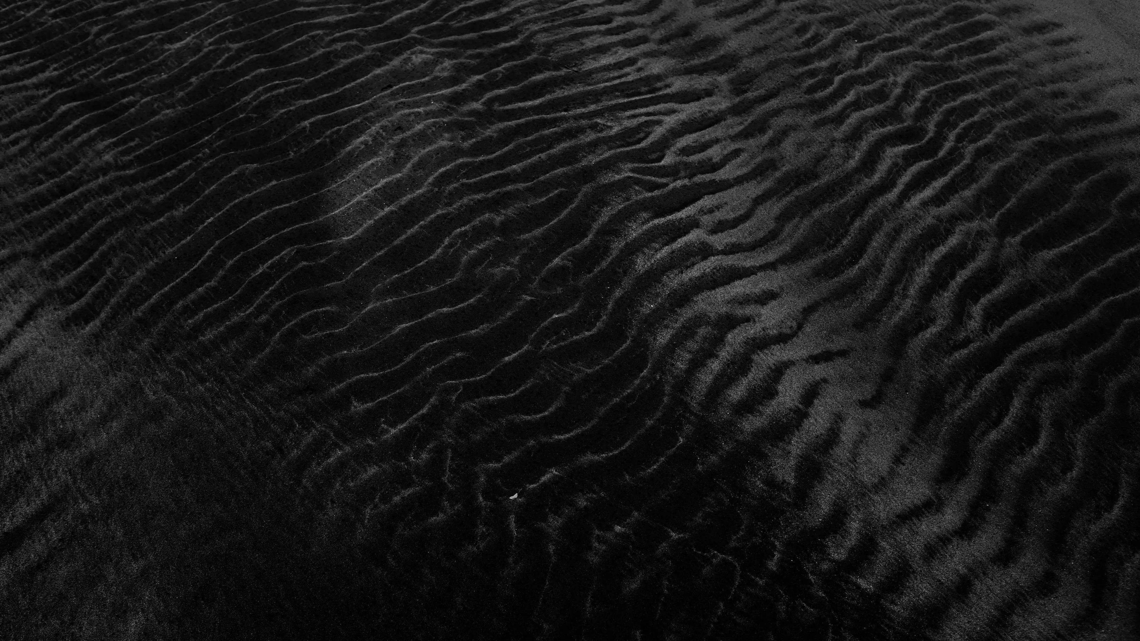 Download wallpaper 3840x2160 sand, black, relief, surface 4k uhd 16:9 HD background