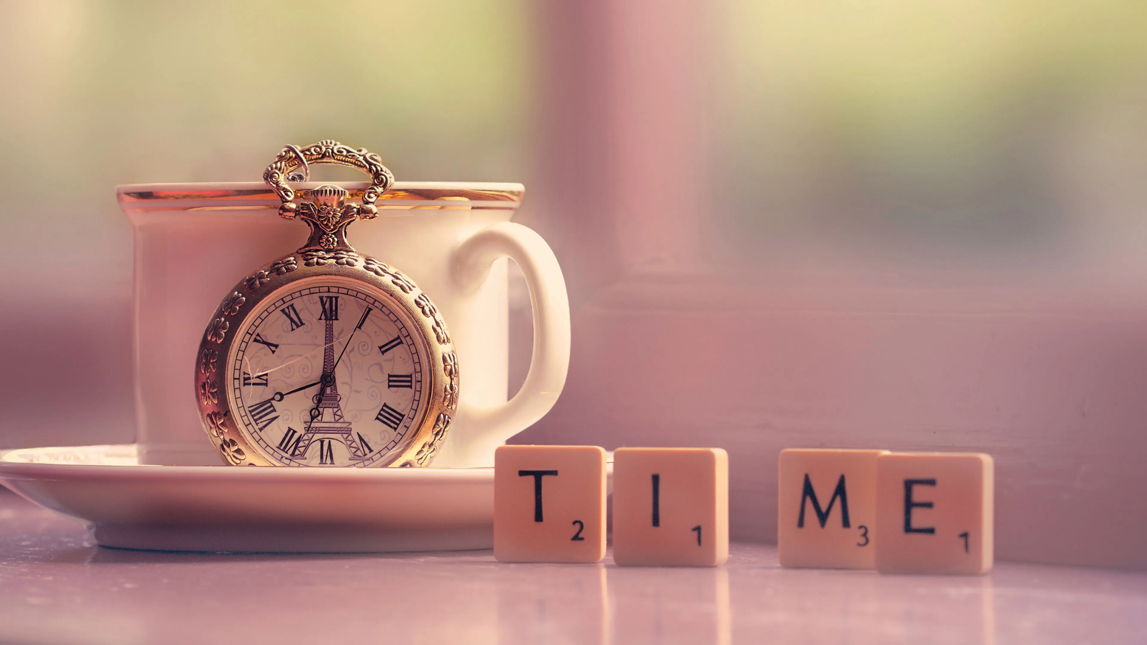 Clock with a cup on a table with dices Desktop wallpaper 600x382